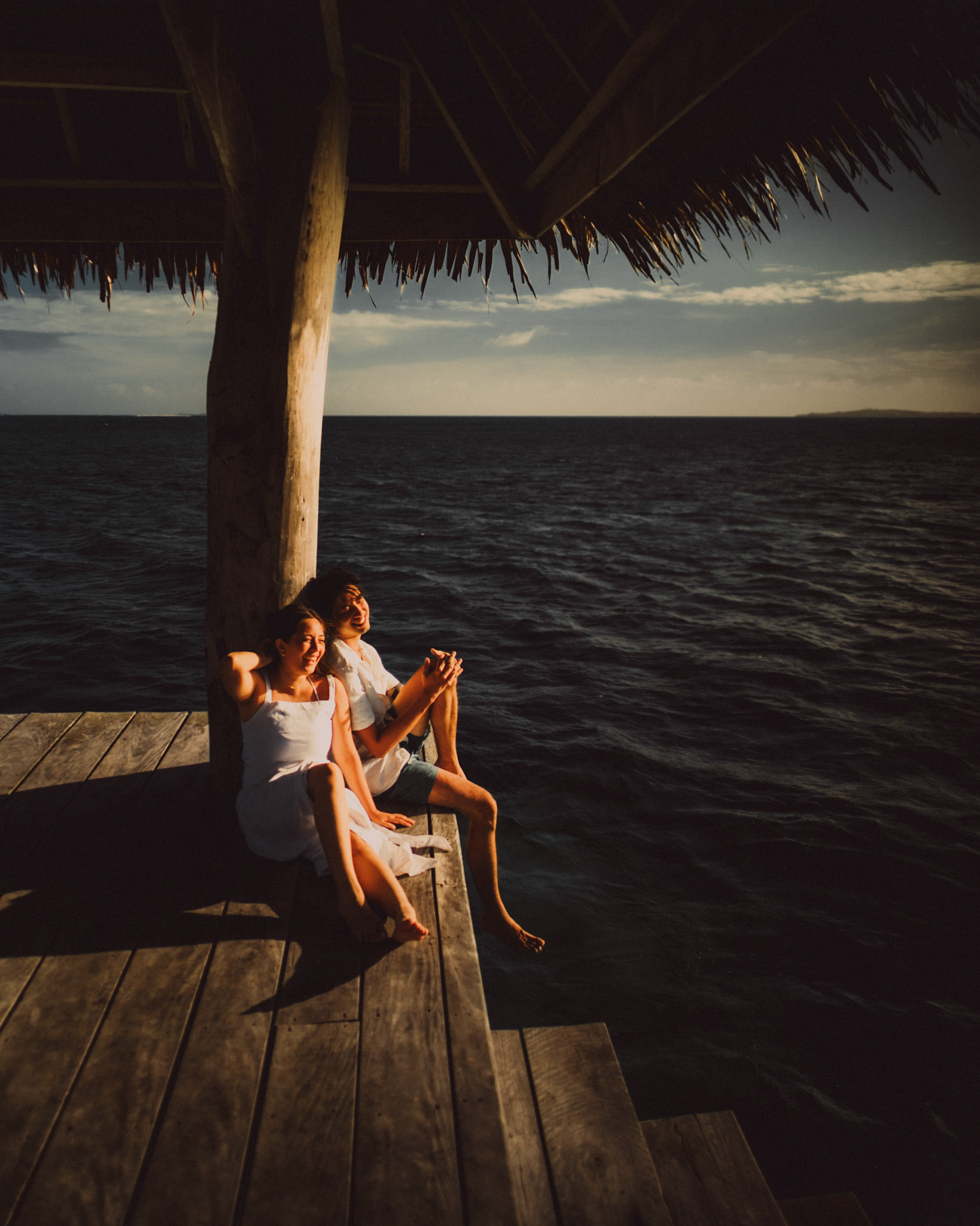 Chill newlywed portraits on Nay Palad Hideaway's floating pagoda in the middle of the sea, from Geo and Bianca's island hopping honeymoon couple portrait shoot in Siargao Island, Philippines, Southeast Asia, February 2020, Sony A7III