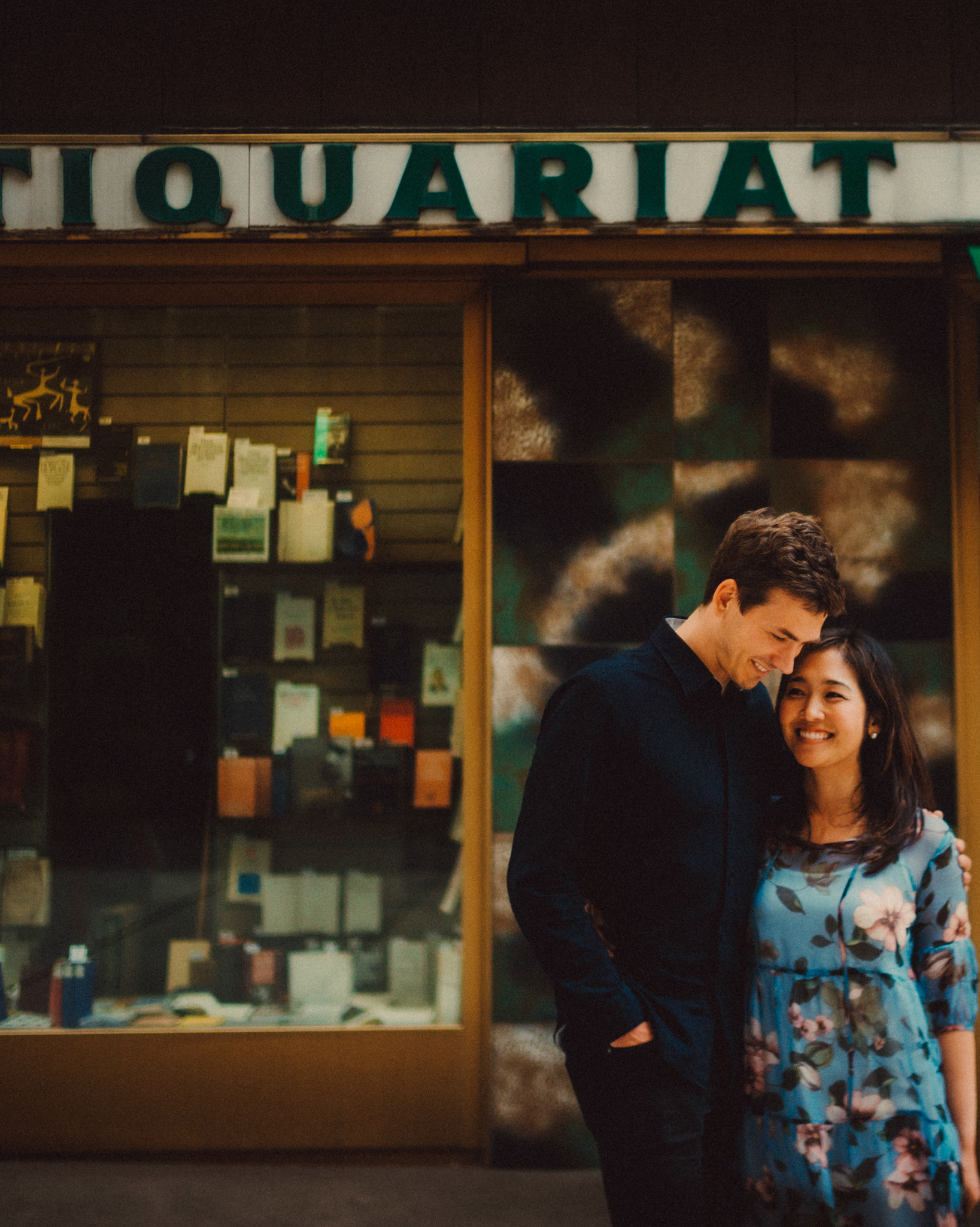 The couple standing in front of a quaint Austrian book shop, Innere Stadt, Vienna, Austria, August 2017, Leica M.