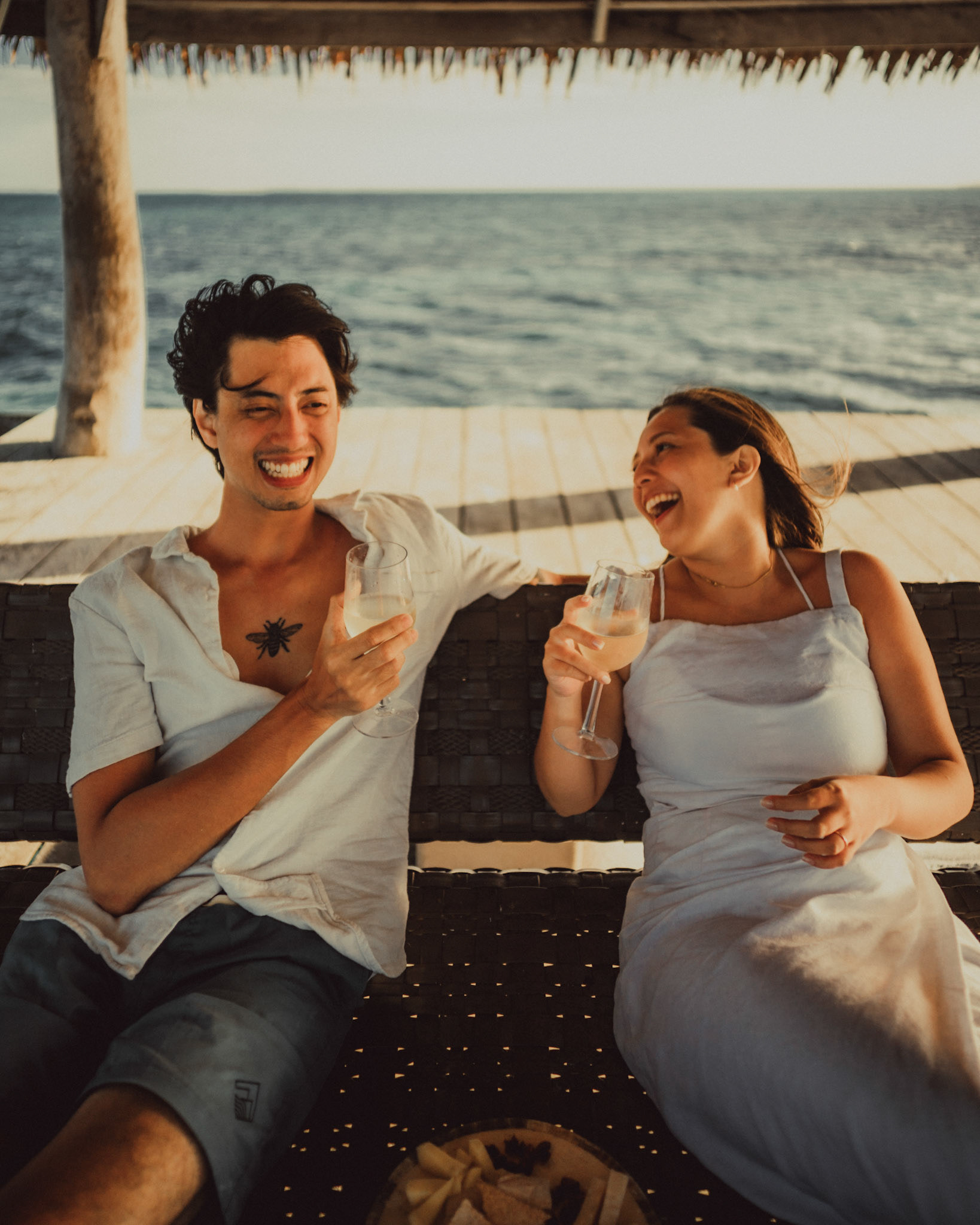 Chill newlywed portraits on Nay Palad Hideaway's floating pagoda in the middle of the sea, from Geo and Bianca's island hopping honeymoon couple portrait shoot in Siargao Island, Philippines, Southeast Asia, February 2020, Sony A7III