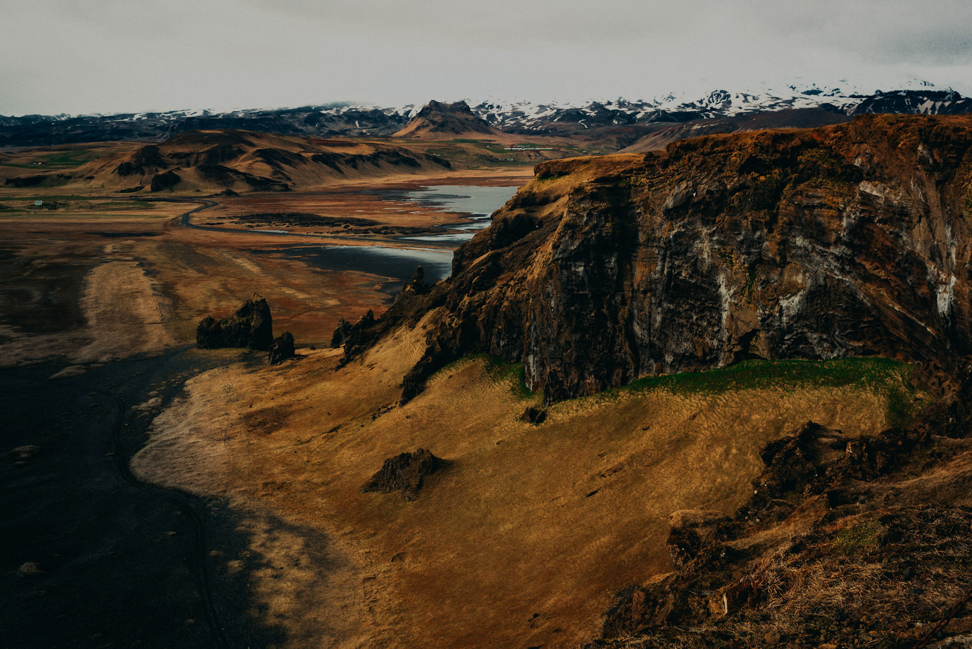 Black sand beach and rocky cliffs from Dyrhólaey Viewpoint, Iceland, May 2016, Leica M.