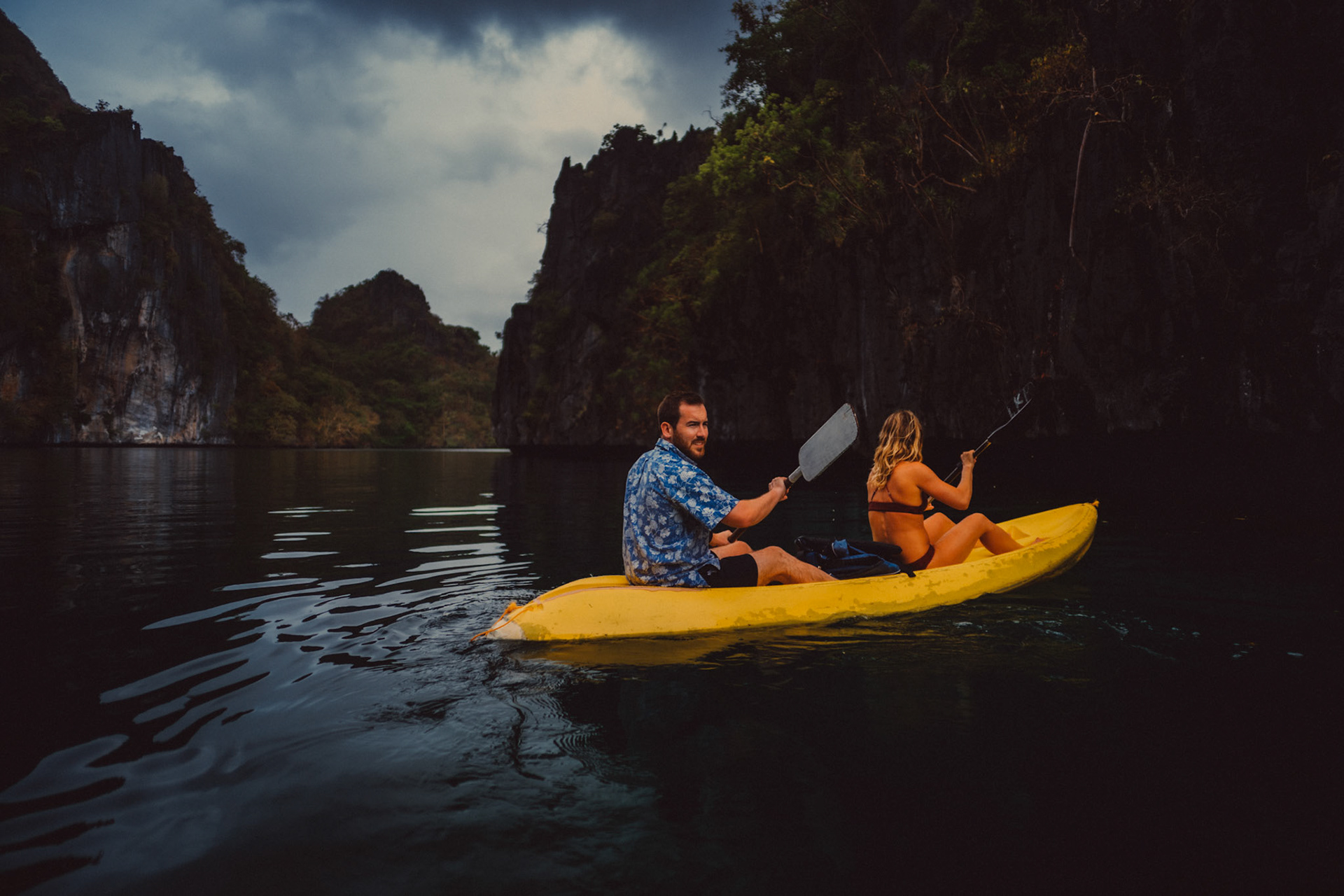 A couple kayaking in an empty Big Lagoon in Miniloc Island, El Nido, Palawan, Philippines, Southeast Asia, March 2019, Sony A7III.