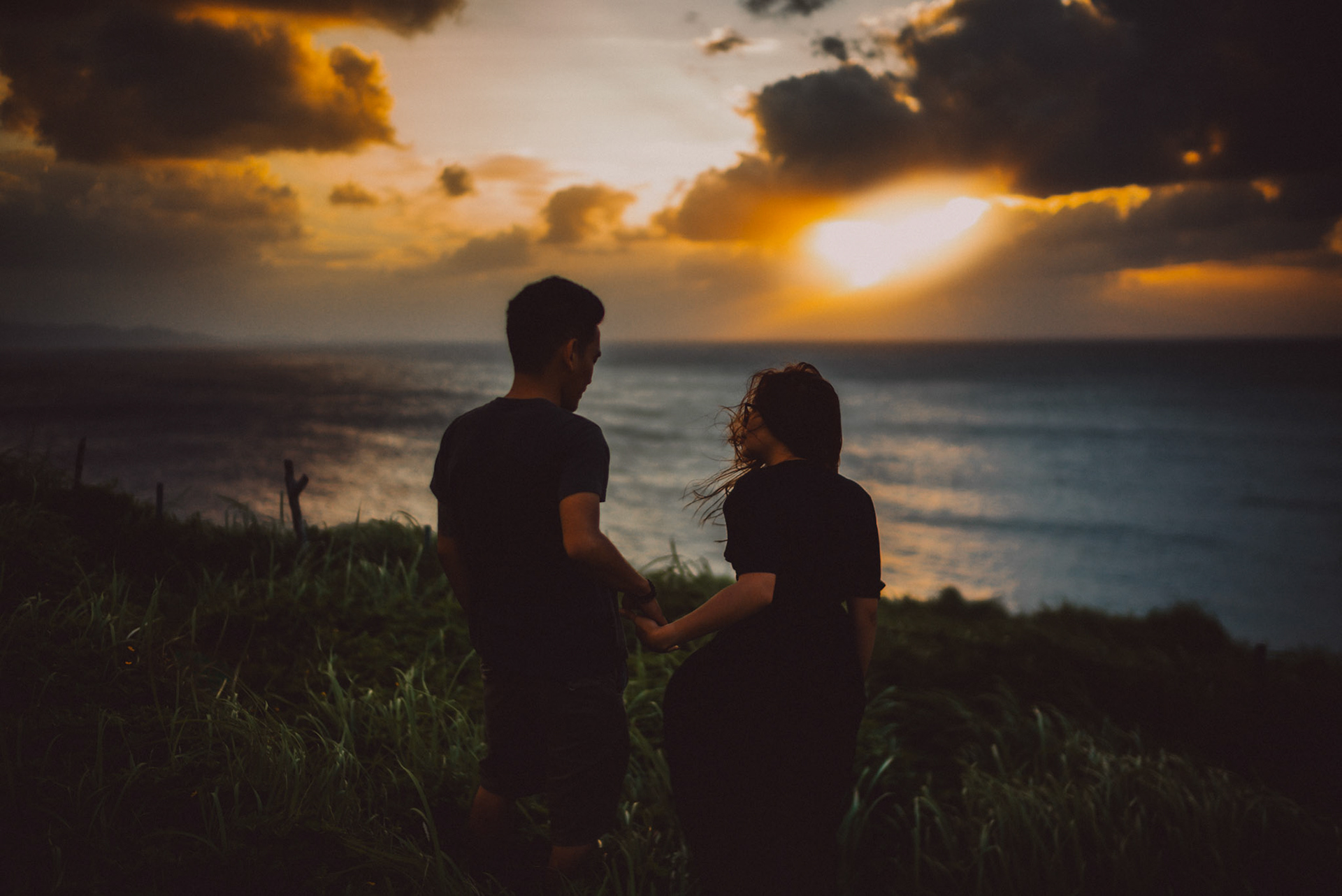 Moody sunset couple portraits on a seaside cliff, from Owen and Nikka's adventure prenup photoshoot in Naidi Hills, Batanes, Philippines, Southeast Asia, October 2017, Leica M.