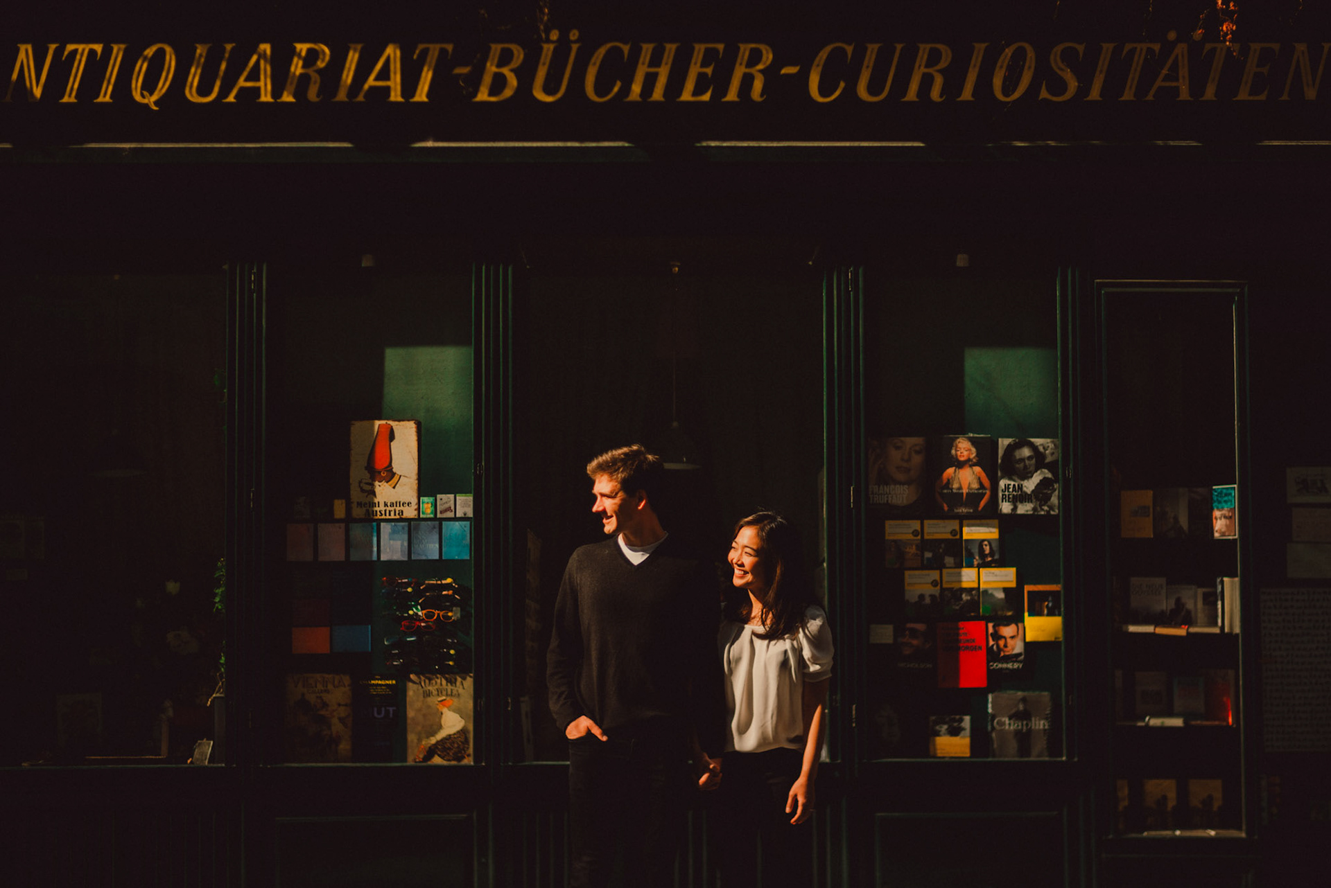 The couple standing in front of a quaint Austrian book shop, Innere Stadt, Vienna, Austria, August 2017, Leica M.