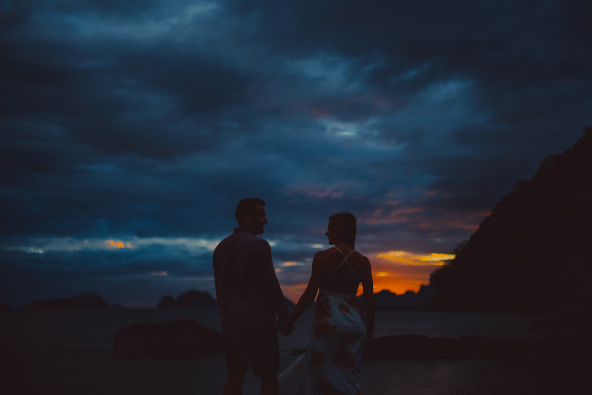Blue hour couple portraits with moody tones in Las Cabanas Beach, El Nido Palawan, Philippines, Southeast Asia, March 2019, Sony A7III.