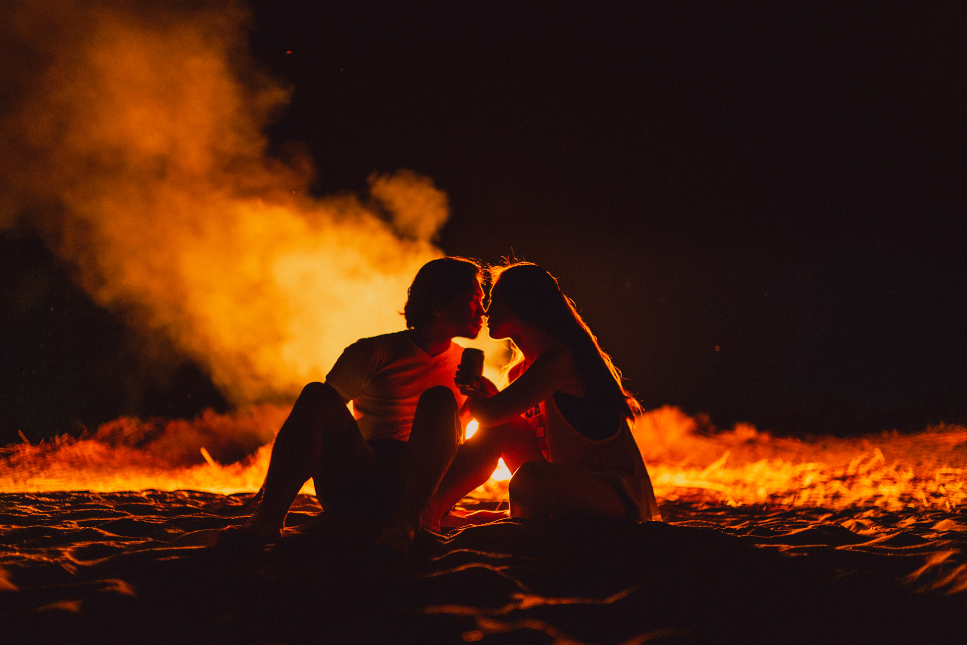 Moody and intimate couple portraits beside a bonfire, from Koke and Pam's chill and outdoorsy prenup photoshoot in Bonuan Beach, Dagupan, Pangasinan, Philippines, Southeast Asia, November 2015, Sony A7S.