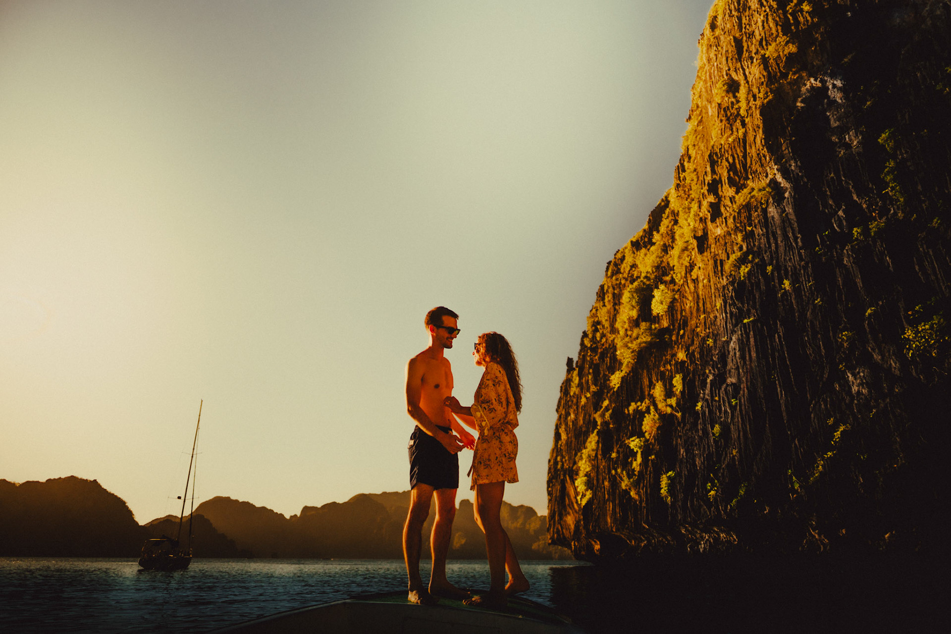 Adventure couple portraits in Entalula Island's secluded west-facing beach just moments before sunset, El Nido, Palawan, Philippines, Southeast Asia, April 2019, Sony A7III.