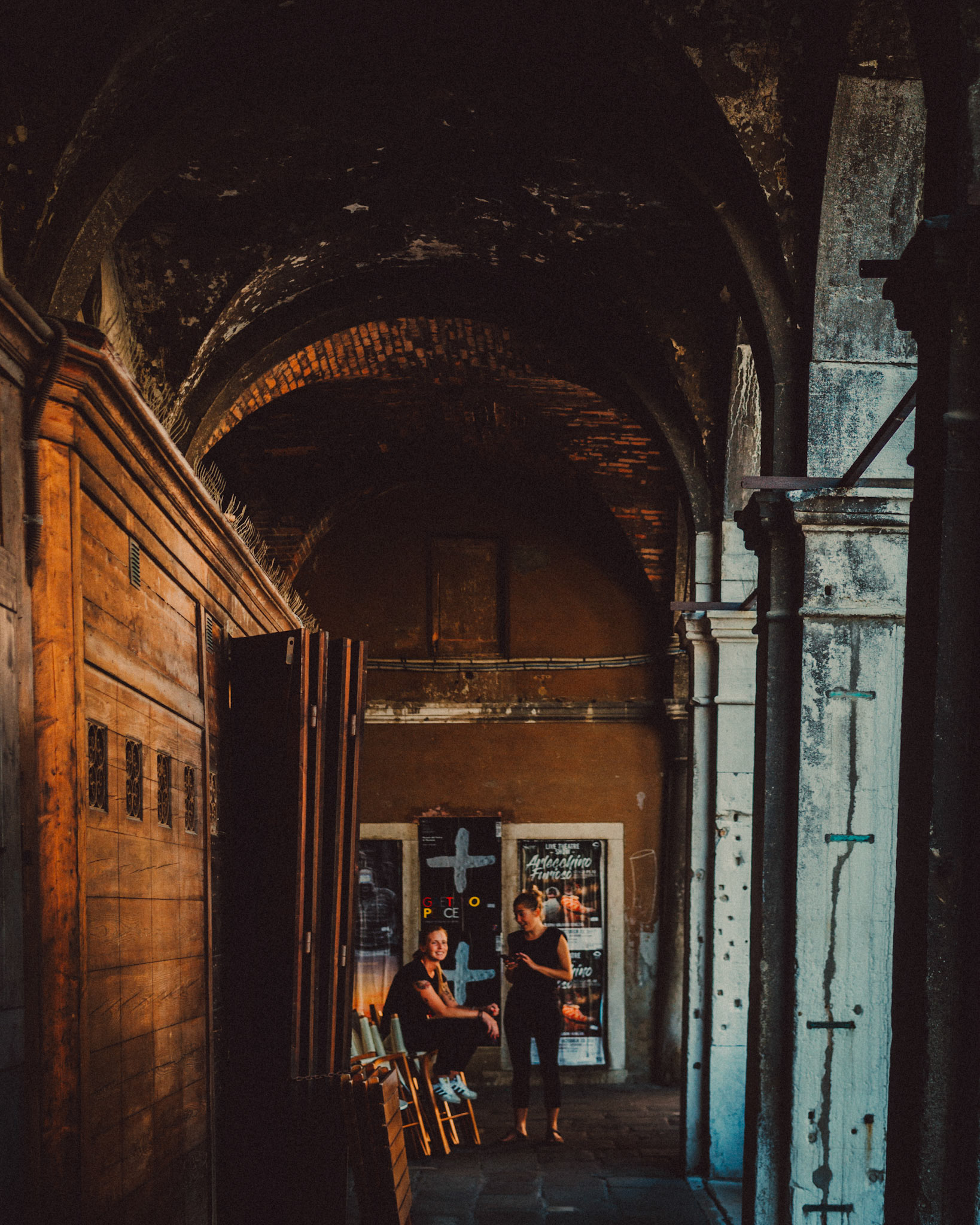 Two waitresses under an archway, Venice, Italy, August 2017, Leica M.