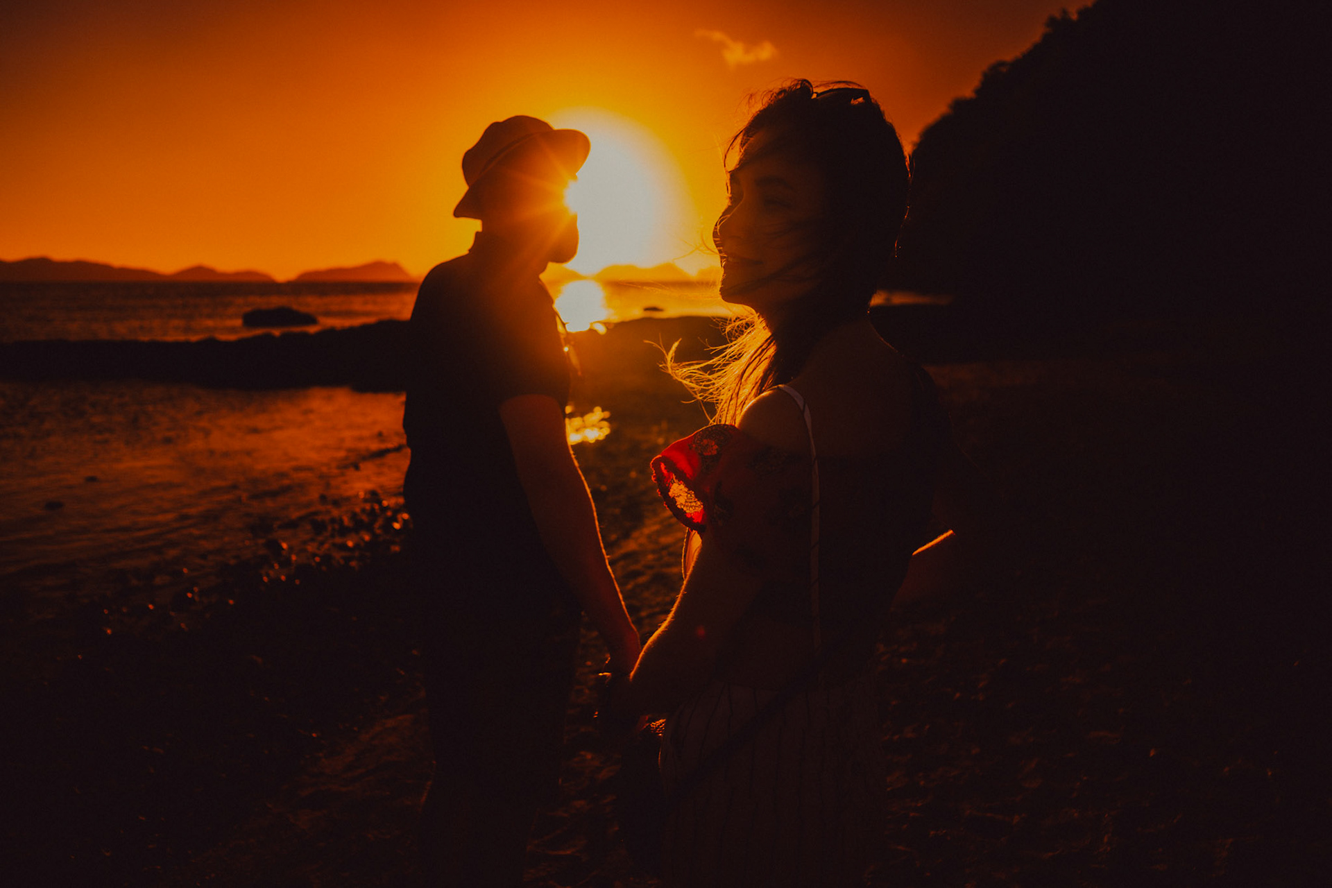 Golden hour moody travel couple portraits, just minutes before sunset, Las Cabanas Beach, El Nido, Palawan, Philippines, Southeast Asia, February 2019, Sony A7III.