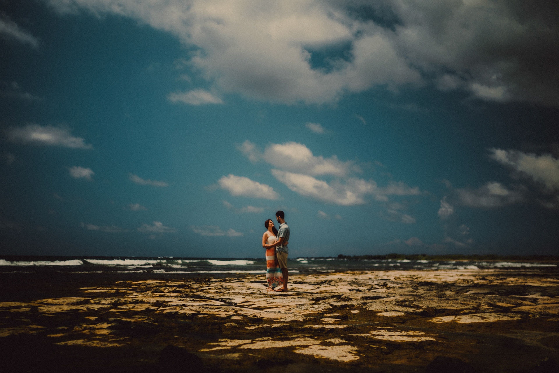 Couple portraits on a rocky beach, from Ryan and Angela's engagement session in Hawaii, USA, September 2015, Sony A7S.