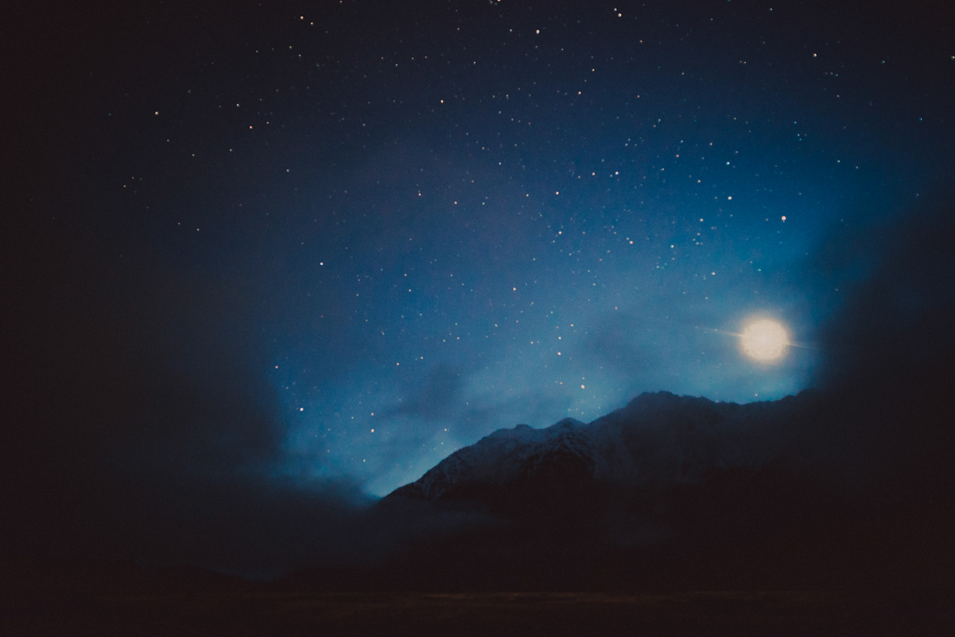Foggy snow-capped mountain tops before sunrise, Canterbury, New Zealand, June 2017, Sony A7SII.