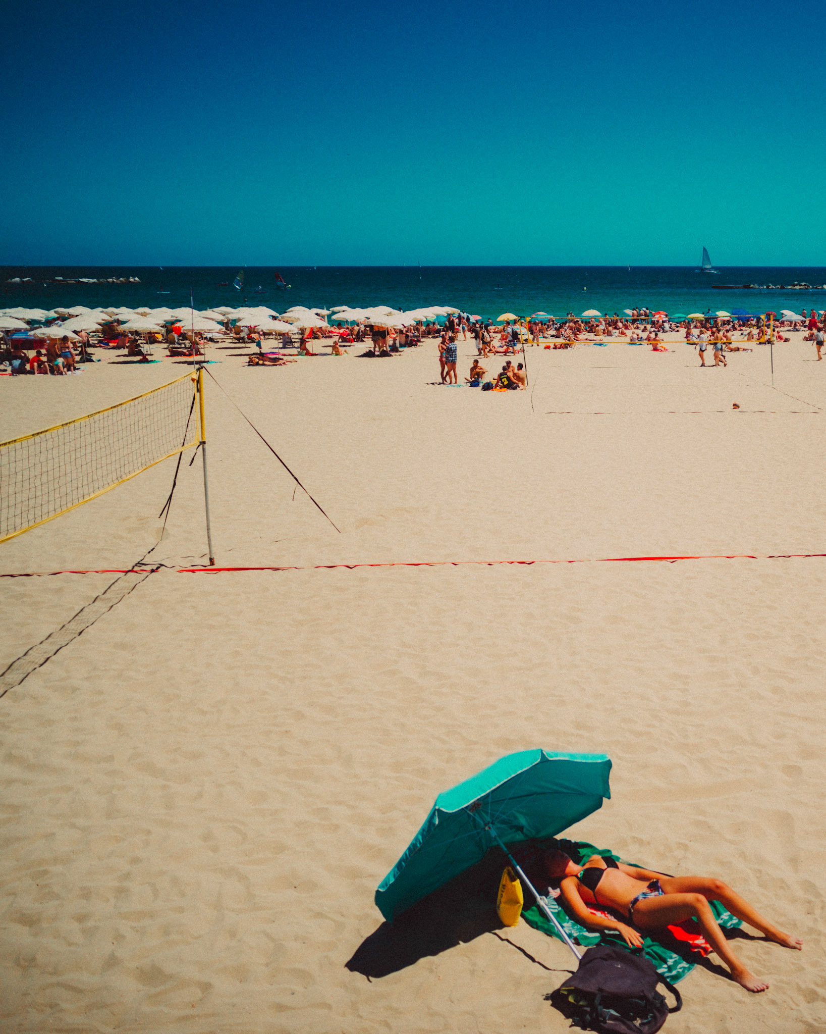 A woman sunbathing in Platja de Sant Miguel, Barcelona, Spain, July 2016, Leica M.