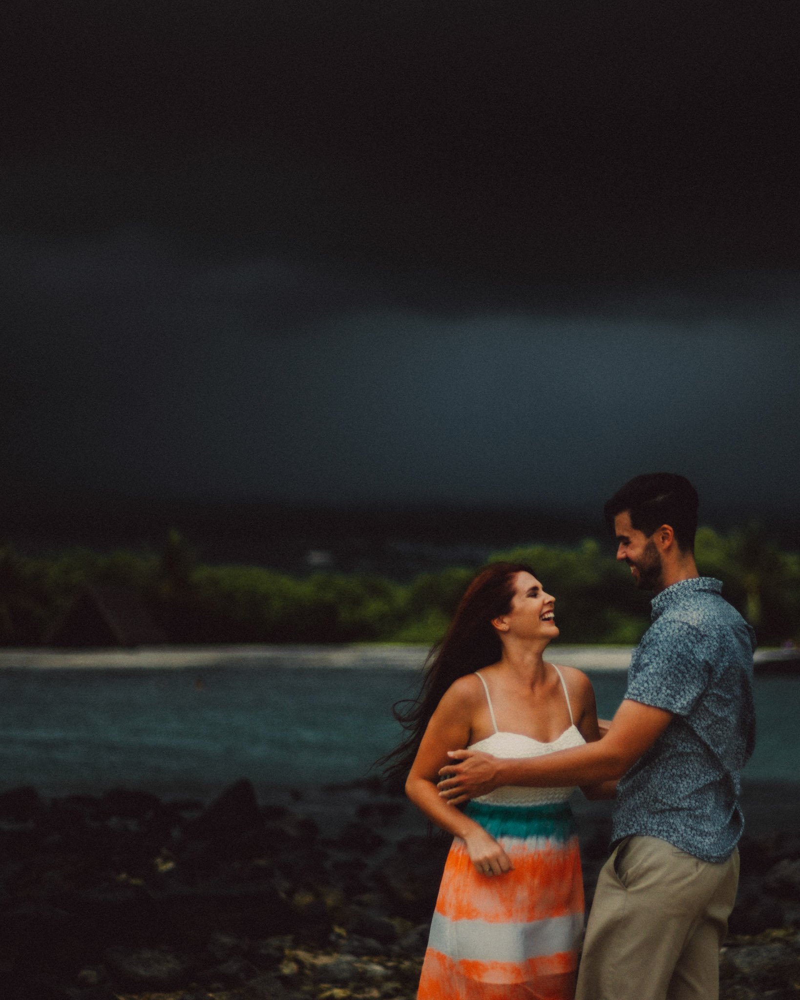 Stormy weather couple portraits at Honokohau Beach, from Ryan and Angela's engagement shoot in Hawaii, USA, September 2015, Sony A7S.