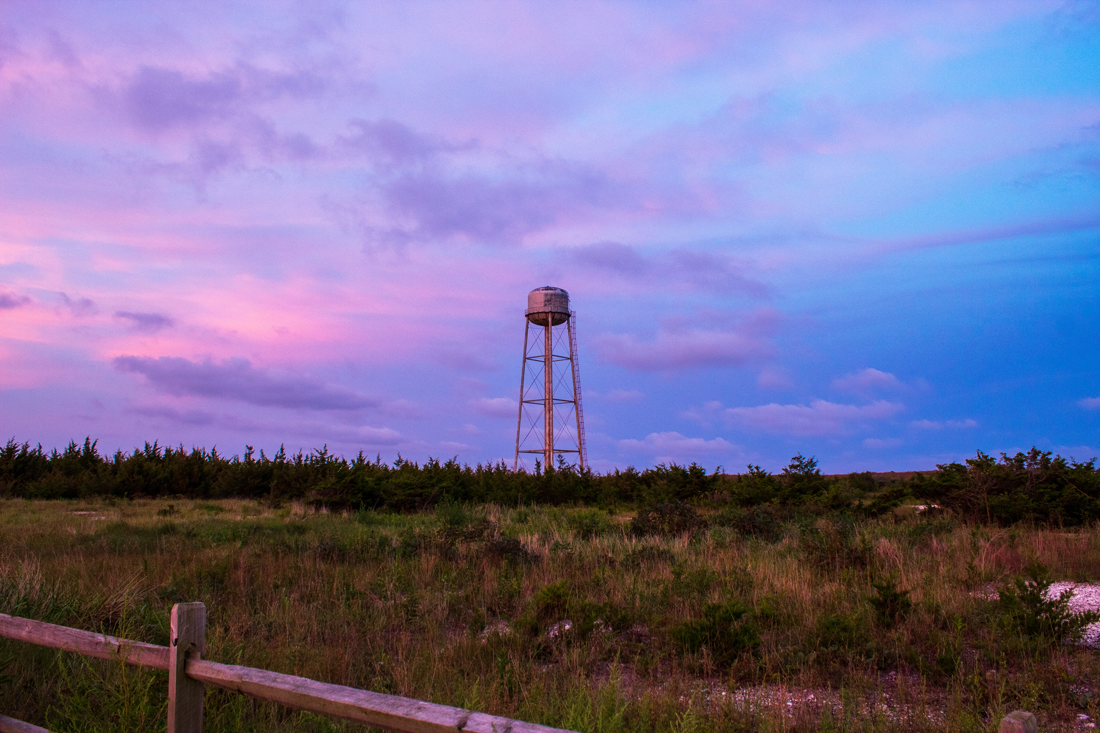 Even water towers facinate with a good sky 