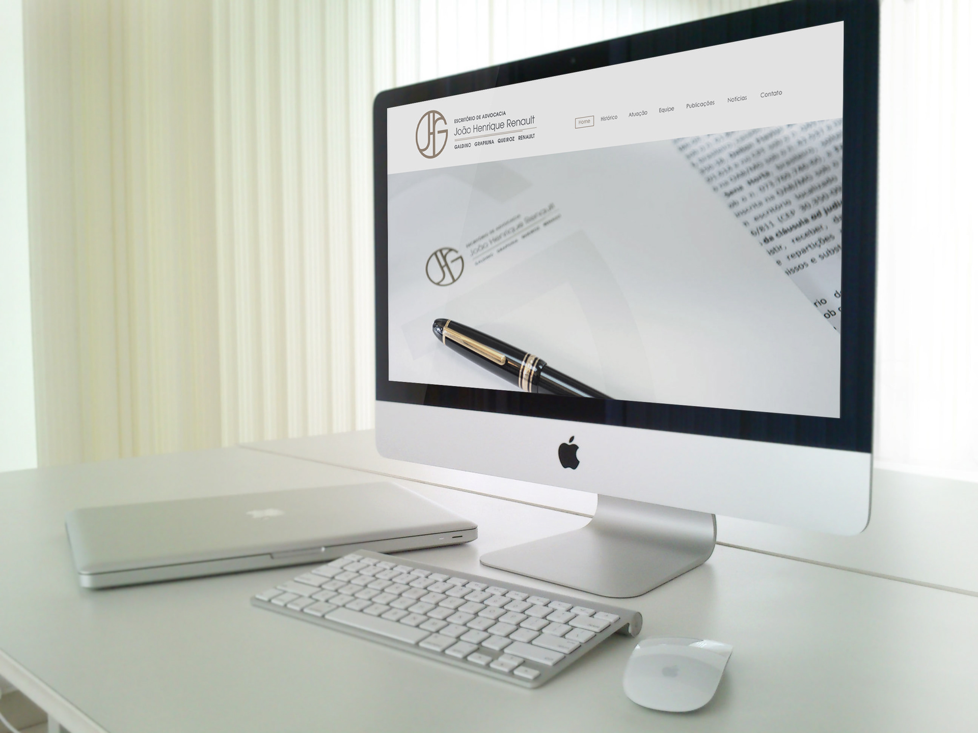 An iMac with the law office's website on the screen.