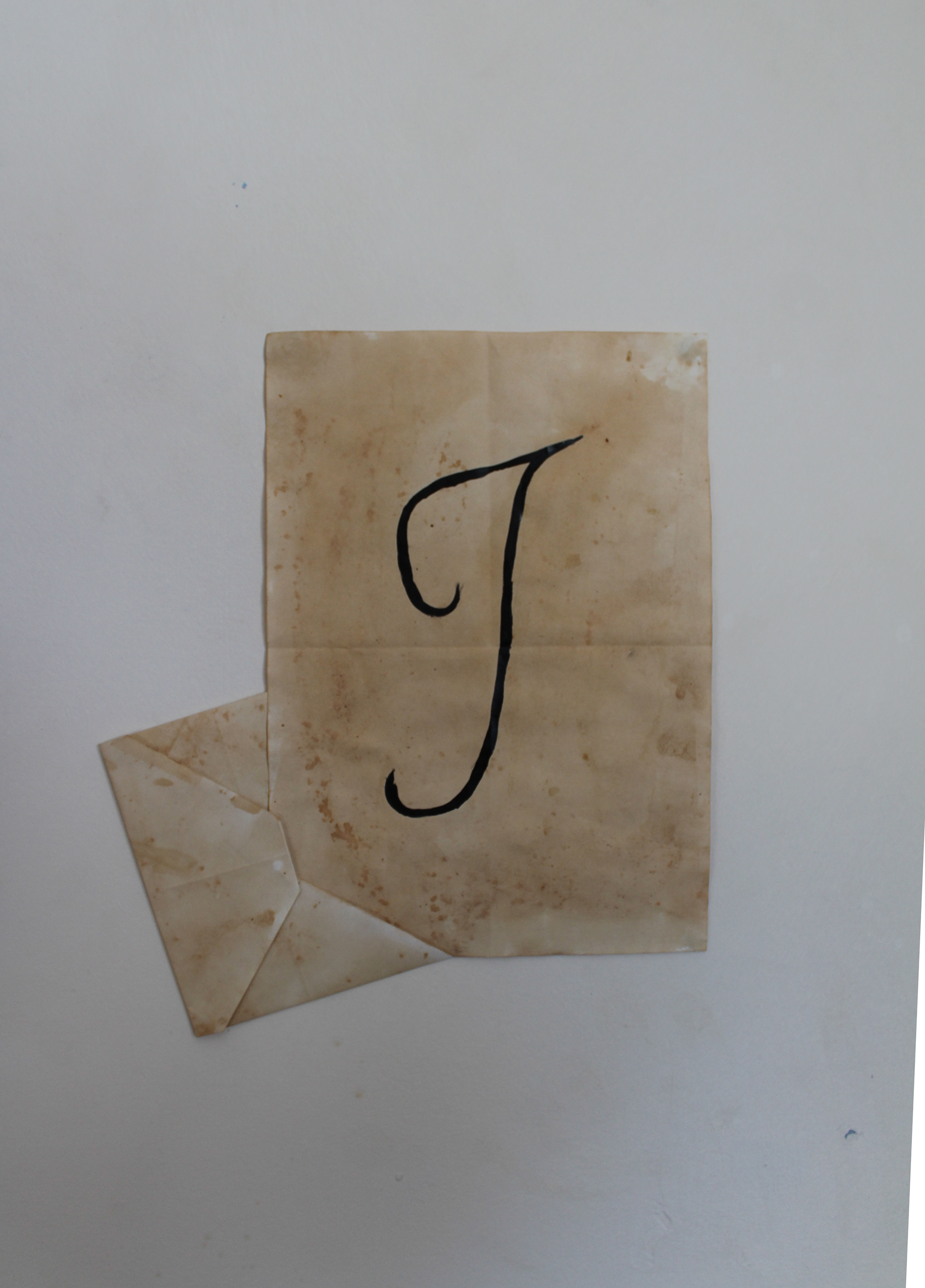 Calligraphy I on aged paper, to represent letter writing