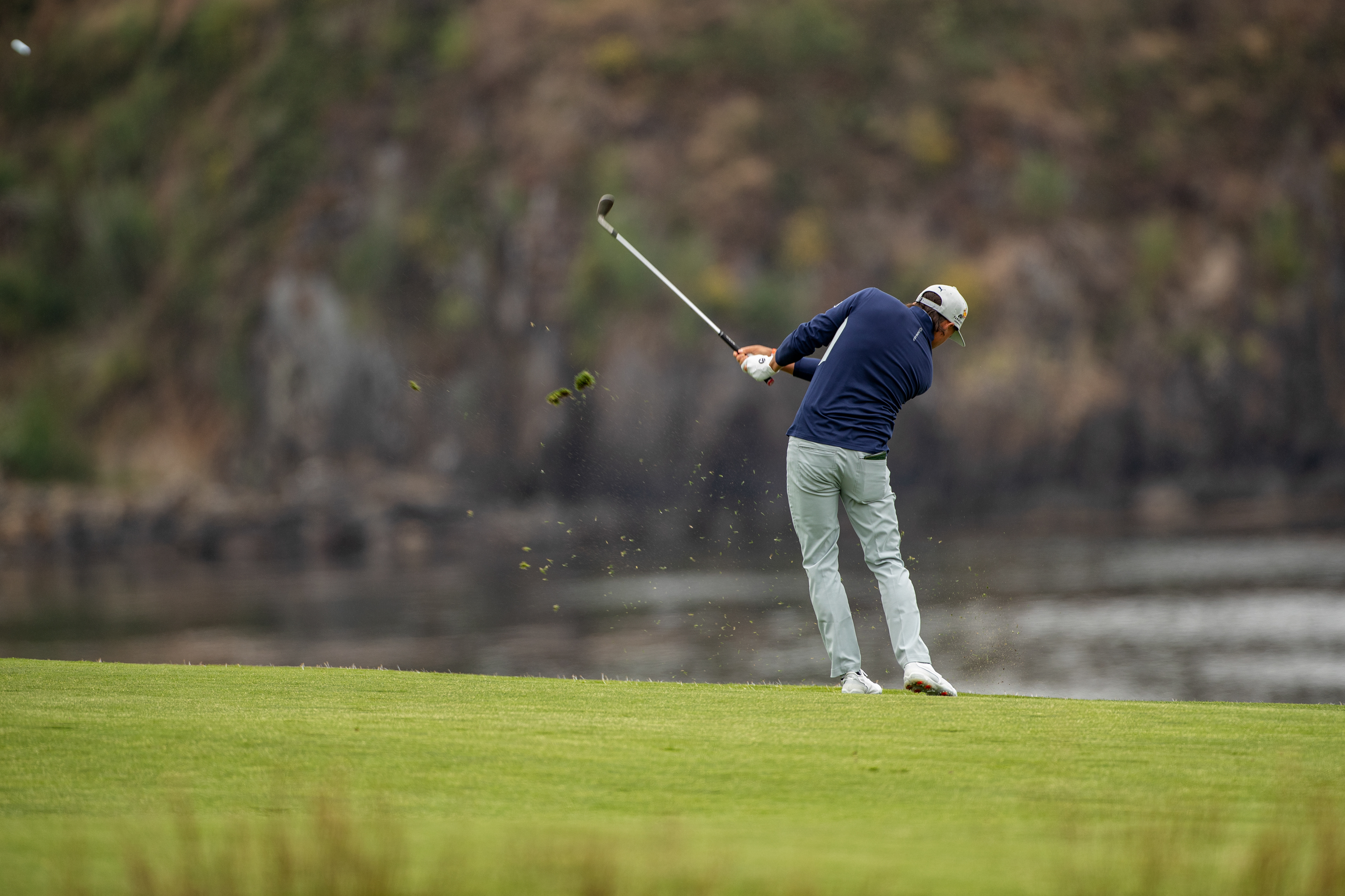 Ricky Fowler hitting a fairway shot