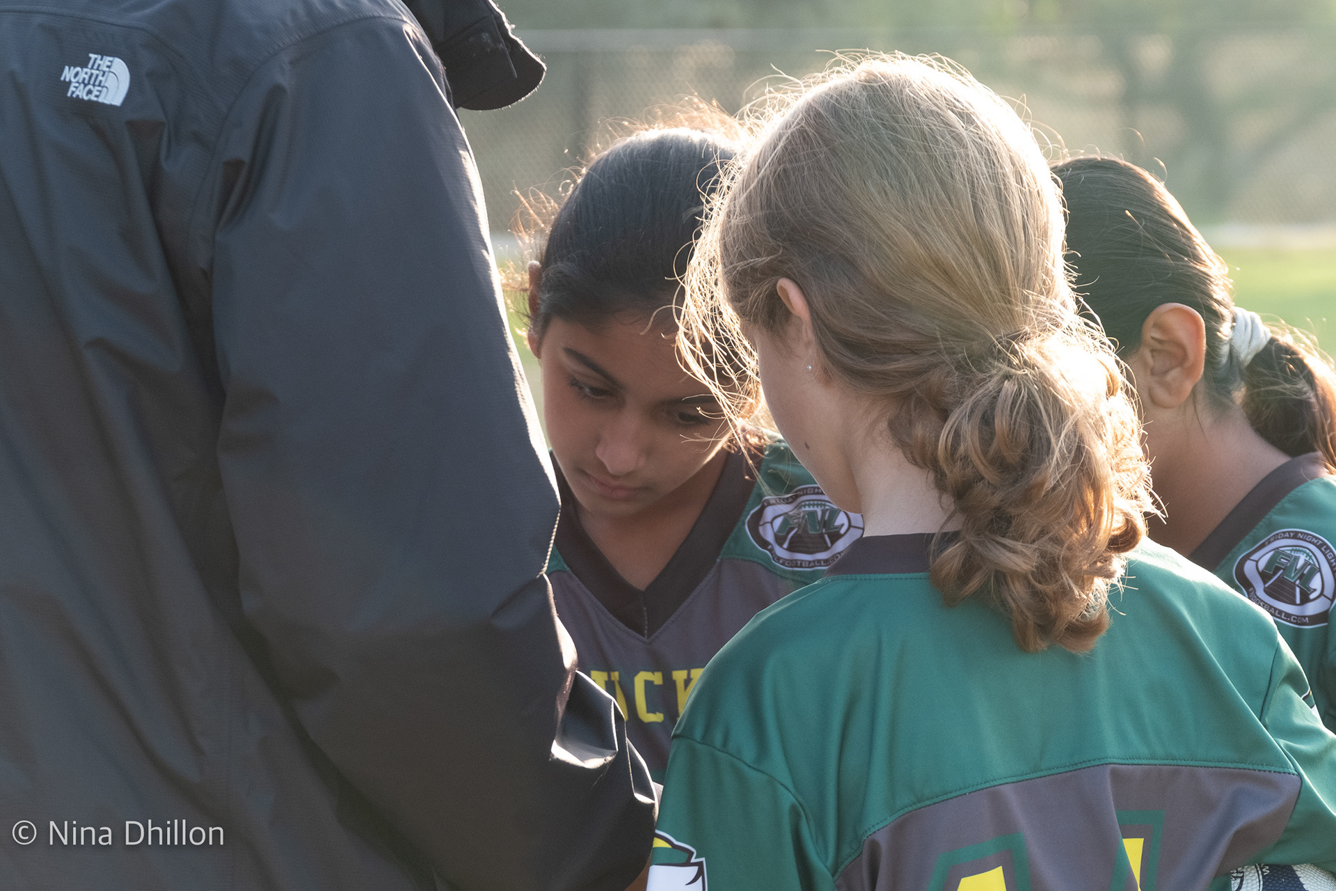 Pre Game: Going over the plays with Assistant Coach. San Diego, CA. By NinaD. ISO 1250 f8.0 1/125 sec 122mm
