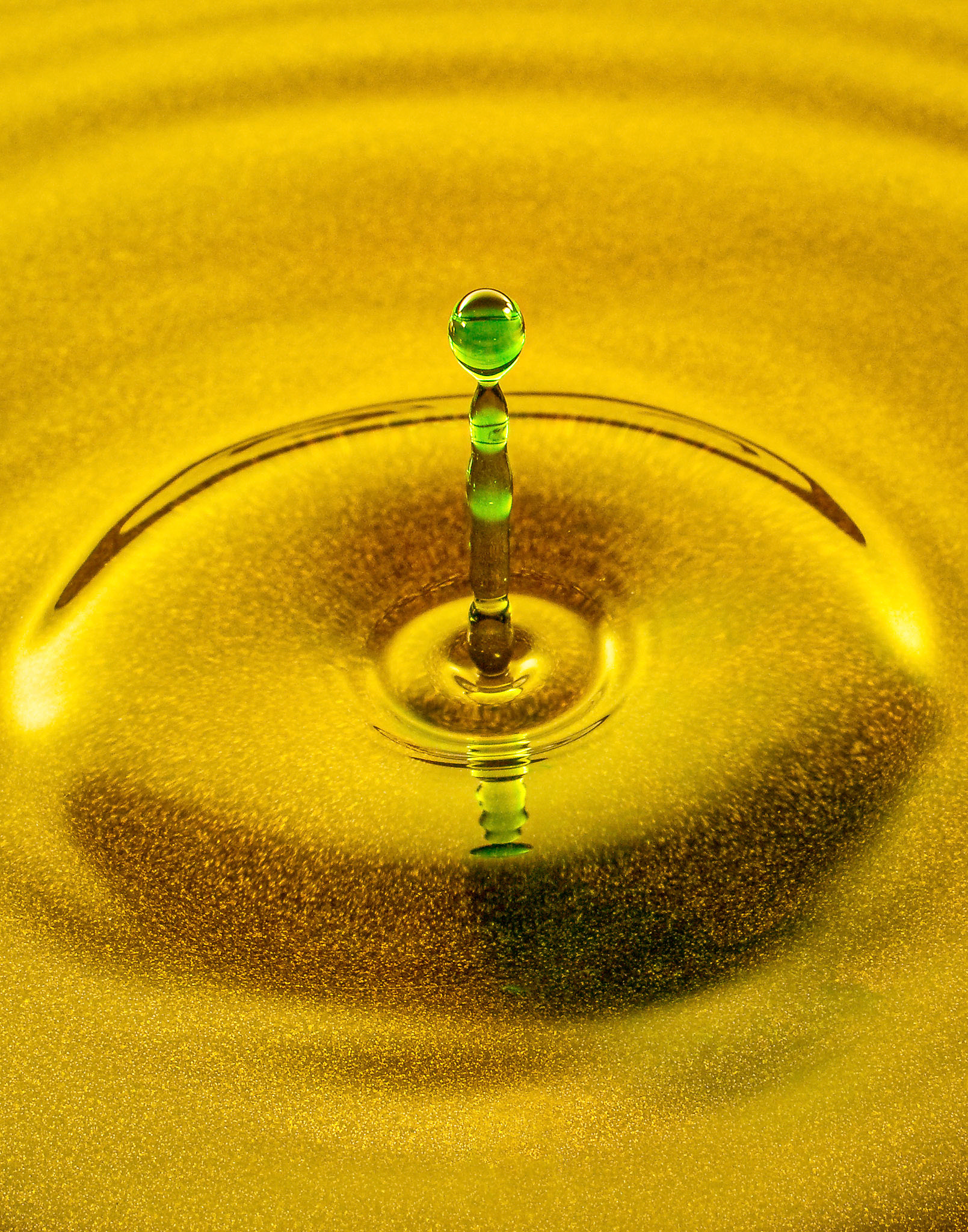 Colored water droplet demonstrating a Worthington Jet