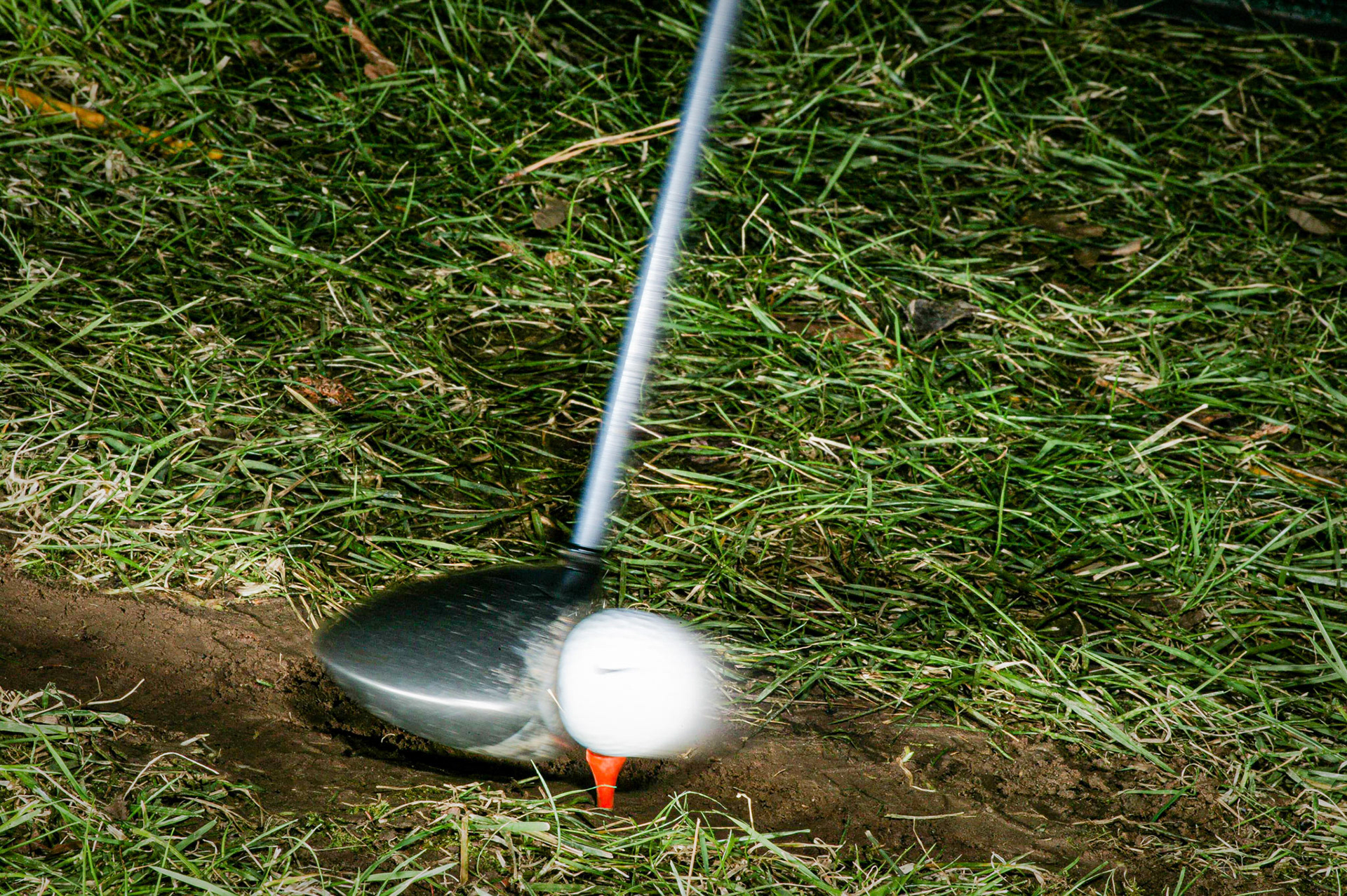 Golf club hitting ball at approx 105 mph. Notice the forward blur...