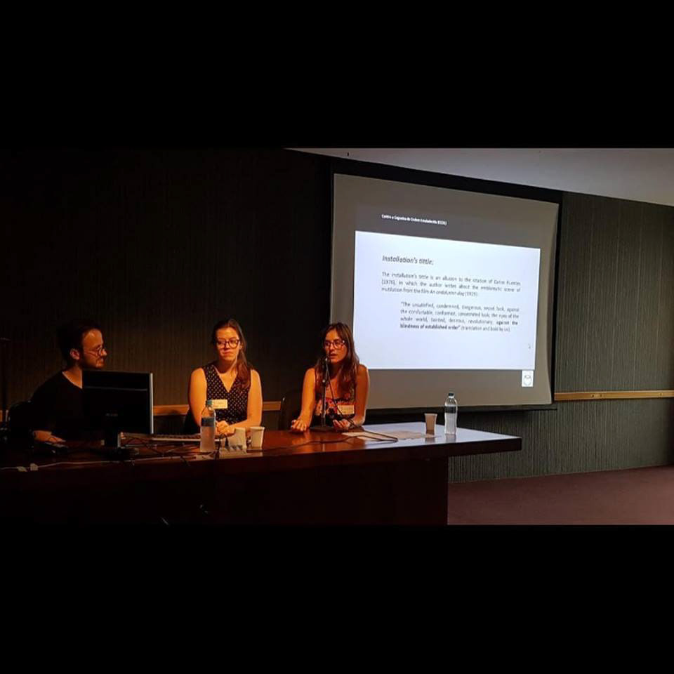 Apresentação de artigo sobre o trabalho Contra a Cegueira da Ordem Estabelecida, do Grupo Realidades - Aline Renner, Bruna Mayer e Clayton Policarpo