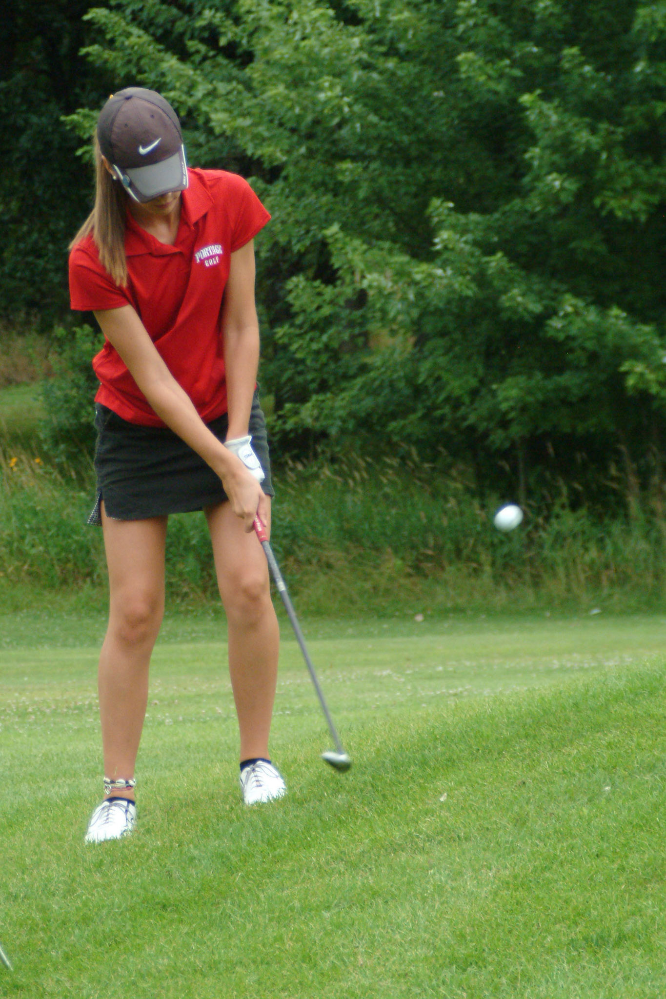 080709tvmGLFLCINVITE_16 Tony V. Martin CRETE-Portage junior Sarah Dienes chips onto the 16th green. Girls Invitational at Longwood Country Club on Friday.