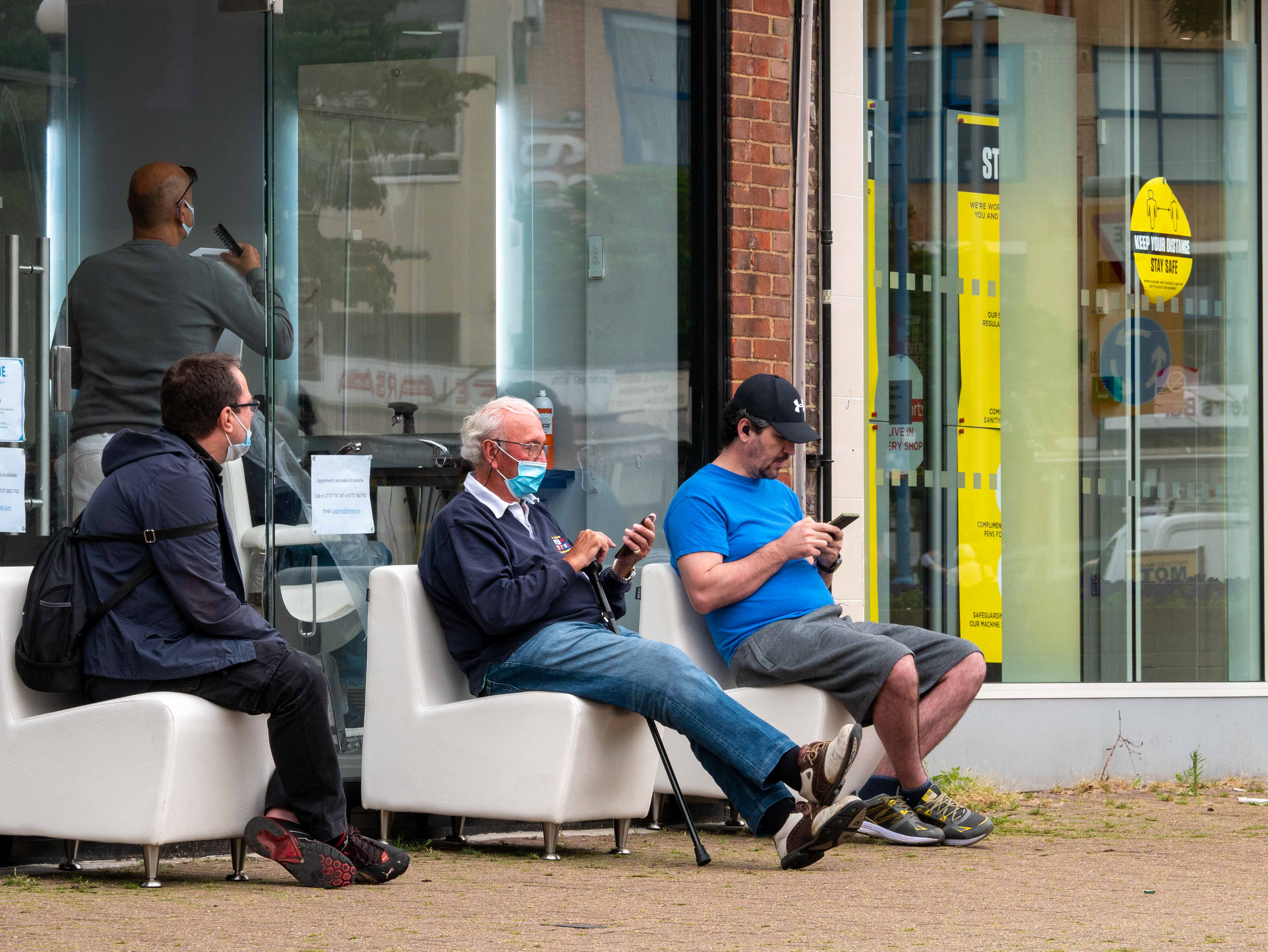 Queuing outside the barber's