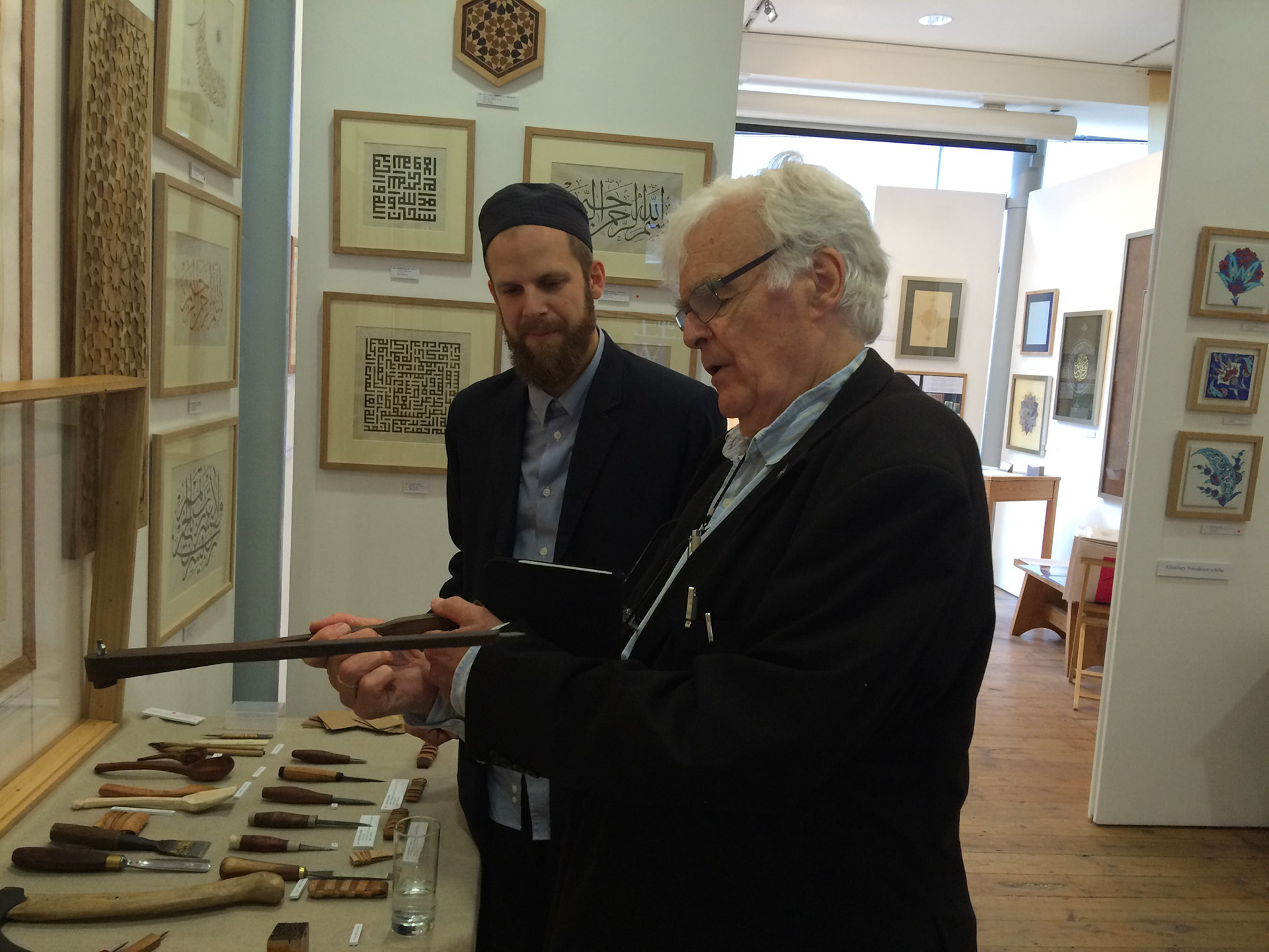 The grand old man of geometry Keith Critchlow inspecting my compass at my exhibition in London