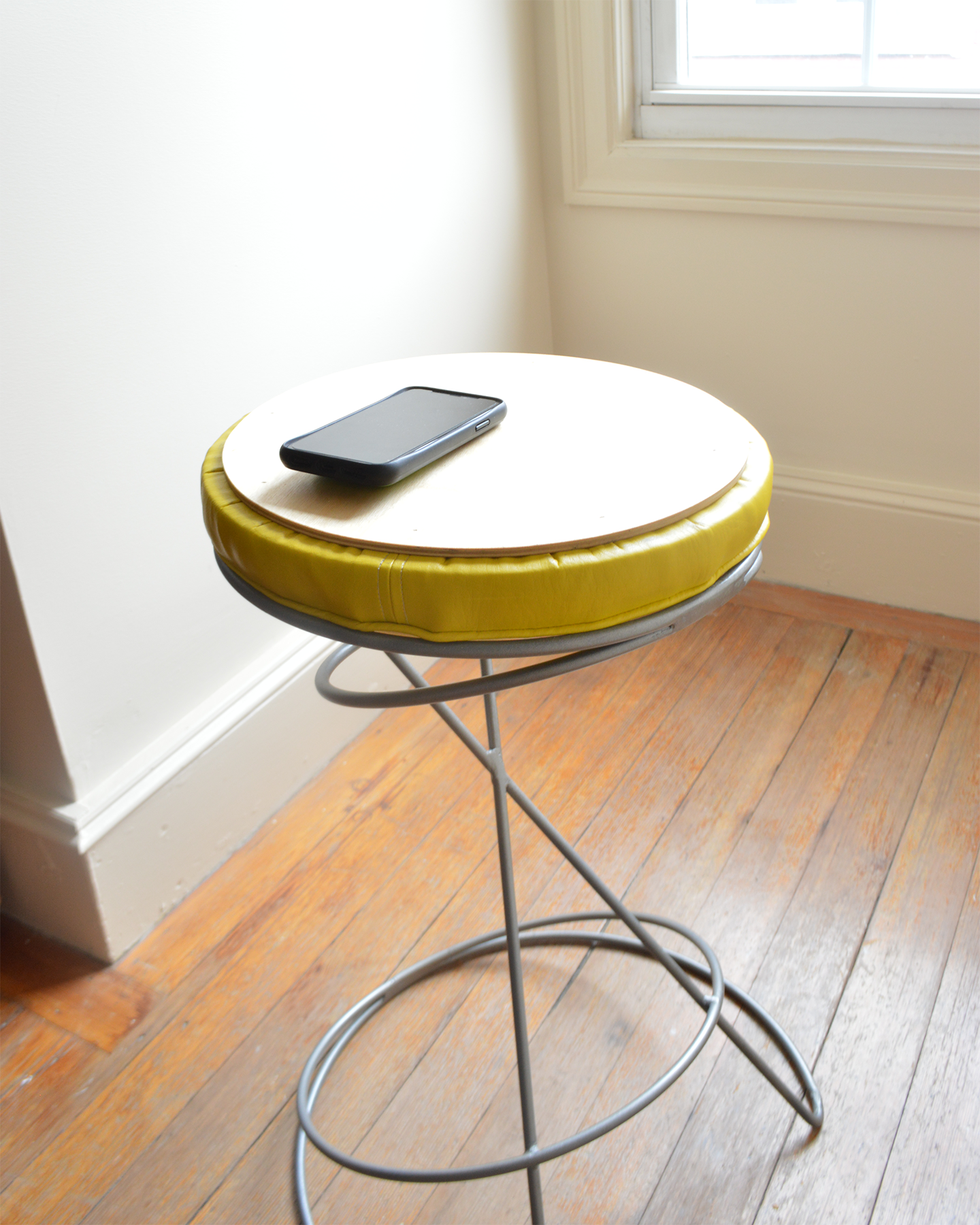 Cushion can be flipped over for a side table surface