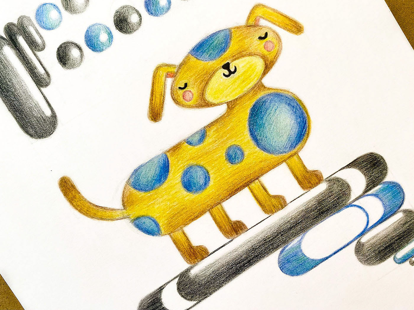 Yellow and Blue Puppy Drawing, close up detail on paper.