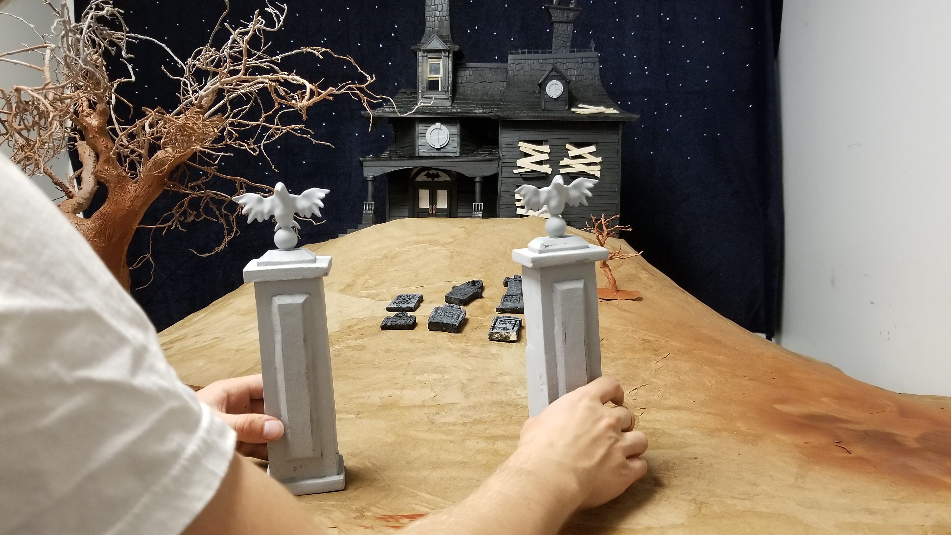 These two gate posts are cut pink foam and 3D printed raven tops.