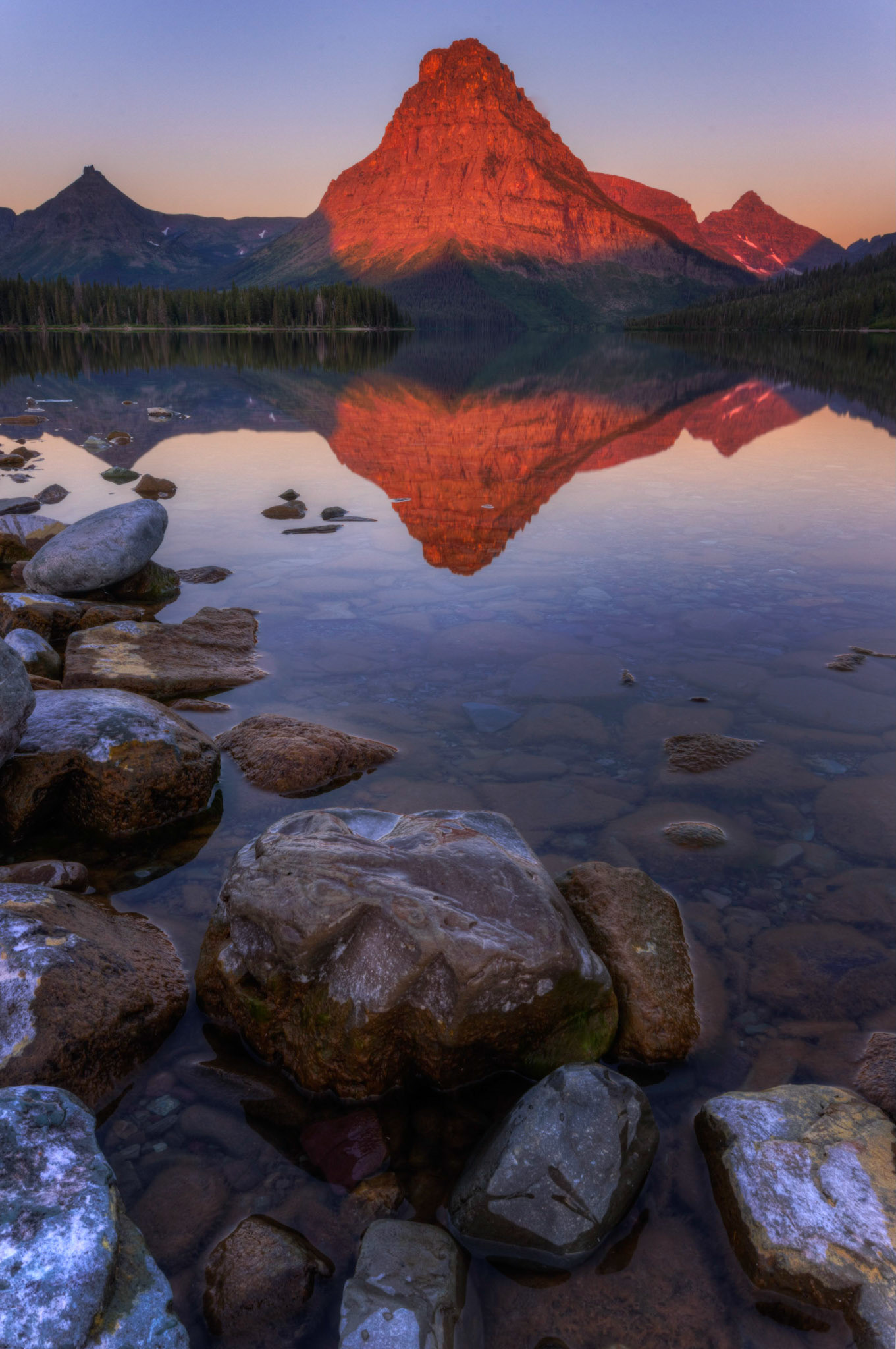 Reflections on Two Medicine LakeGlacier National ParkJuly 30, 2015This is an HDR image consisting of 5 exposures merged in Photomatix Pro. Additional processing in Lightroom and Photoshop.PENTAX K-3, Sigma 10-20mm f/4-5.6 EX DCISO 100 17 mm  0.8 sec at ƒ / 22