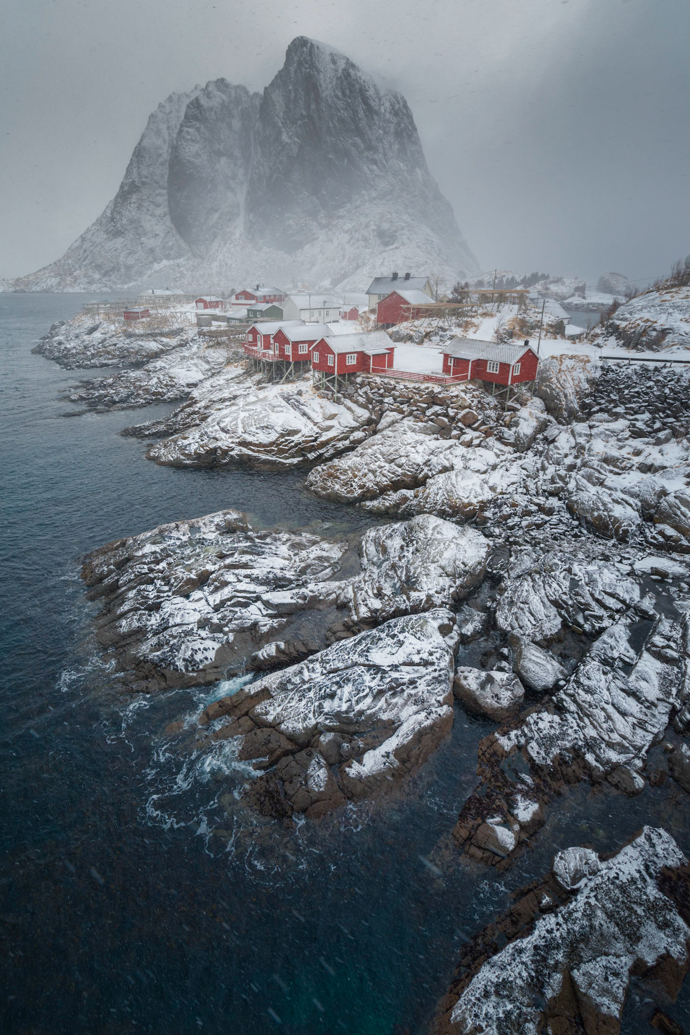 The village of Hamnøy, from the bridge toward the village of Reine.   While it may not look like it, the sky was full of snow and graupel, along with very gusty winds.Hamnøy, Nordland, NorwayMarch 18, 2018PENTAX K-1, HD PENTAX-D FA 15-30mm F2.8ED SDM WRISO 400 15 mm  ¹⁄₂₀₀ sec at ƒ / 11