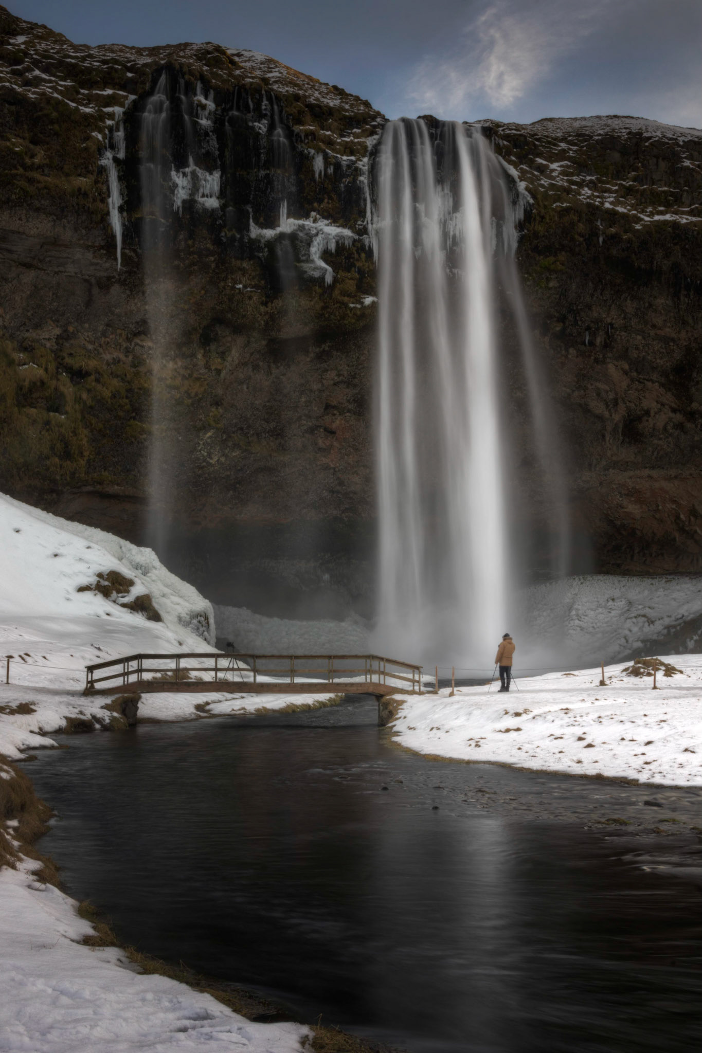 Seljalandsfoss, where the Seljalandsá River descends off of Eyjafjallajökull, shortly before it joins the Markarfjolt.Suðerland, IcelandFebruary 8, 2016This is an HDR image consisting of 5 exposures merged in Photomatix Pro. Additional processing in Lightroom and Photoshop.PENTAX K-3, Sigma 18-250mm f/3.5-6.3 DC OS HSMISO 100 28 mm  0.4 sec at ƒ / 22