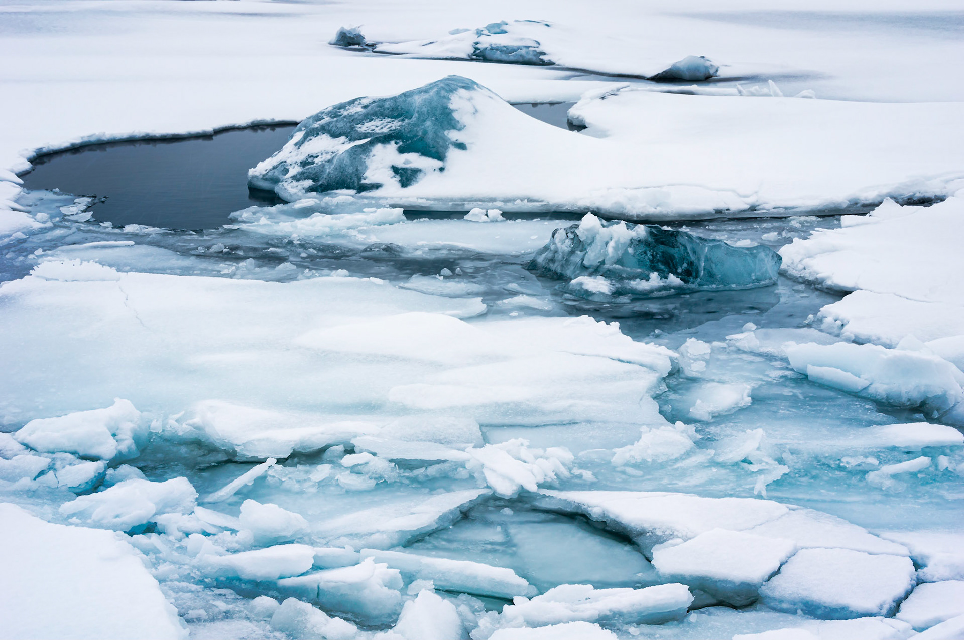 Ice in the glacial lagoon of Jökulsárlón.VatnajökulsþjóðgarðurAusturland, IcelandFebruary 10, 2016Pentax K-3, Sigma 18-250mm f/3.5-6.3 DC OS HSMISO 100 45 mm  ⅙ sec at ƒ / 13