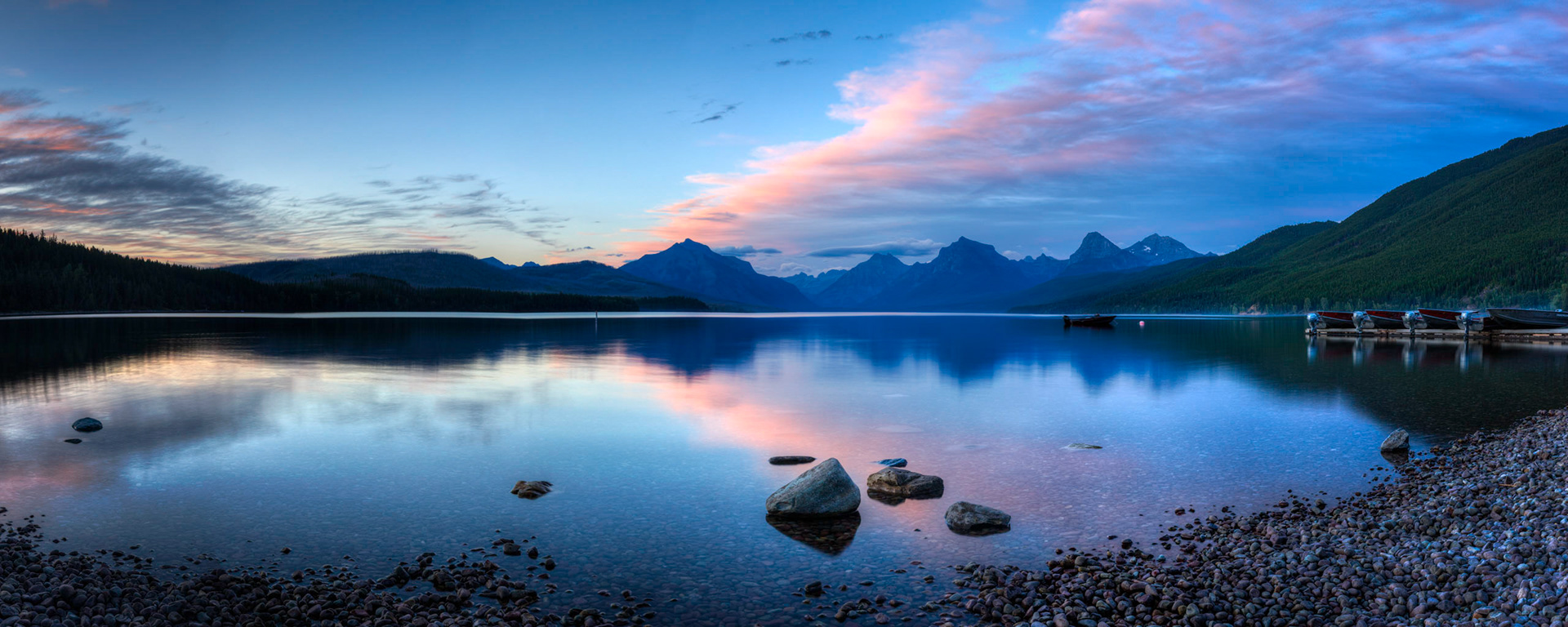 Shortly after sunset at Lake McDonald.  It really wasn't particularly calm on this evening.Glacier National ParkJuly 26, 2015This is an HDR panoramic image consisting of 6 frames comprised of 5 exposures each. HDR processing performed in Photomatix Pro.  Panoramic stitching performed in Photoshop. Additional processing performed in Lightroom and Photoshop.PENTAX K-3, Sigma 18-35mm f/1.8 DC HSM ArtISO 100 26 mm  2.5 sec at ƒ / 11