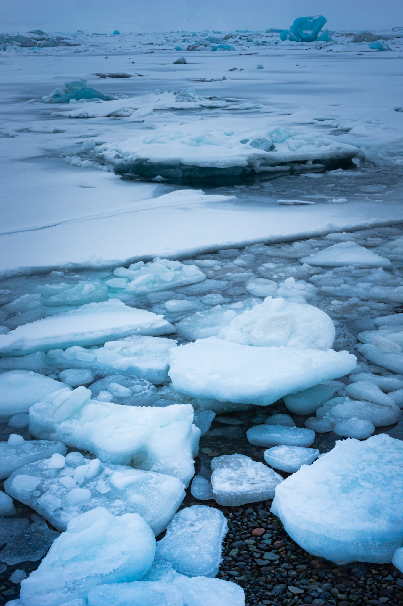 Ice in the glacial lagoon of Jökulsárlón.VatnajökulsþjóðgarðurAusturland, IcelandFebruary 10, 2016Pentax K-3, Sigma 18-250mm f/3.5-6.3 DC OS HSMISO 100 32 mm  0.4 sec at ƒ / 22