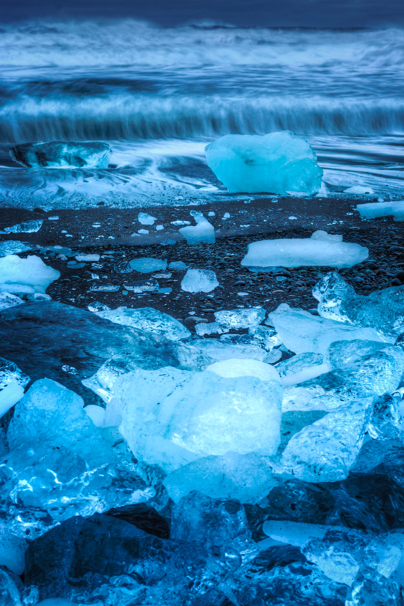 The evening blue hour on the ice beach near Jökulsárlón.Austurland, IcelandFebruary 1, 2016This is an HDR image consisting of 3 exposures merged in Photomatix Pro. Additional processing in Lightroom and Photoshop.PENTAX K-3, Sigma 18-35mm f/1.8 DC HSM ArtISO 100 35 mm  13.0 sec at ƒ / 14