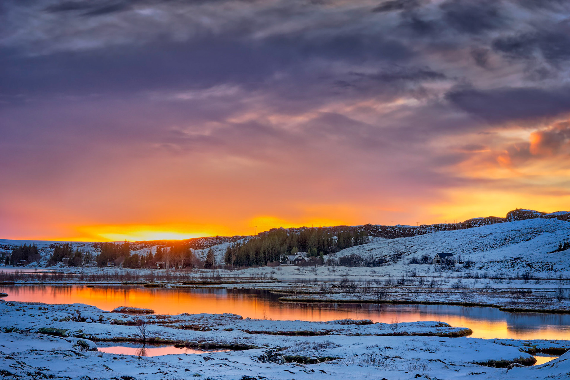 Sunset in Þingvellir National Park, near Silfra, in the rift between the North American and European tectonic plates.Þingvellir National ParkSuðerland, IcelandFebruary 7, 2016This is an HDR image consisting of 10 exposures merged in Photomatix Pro. Additional processing in Lightroom and Photoshop.PENTAX K-3, Sigma 18-250mm f/3.5-6.3 DC OS HSMISO 100 45 mm  ¹⁄₂₅ sec at ƒ / 11