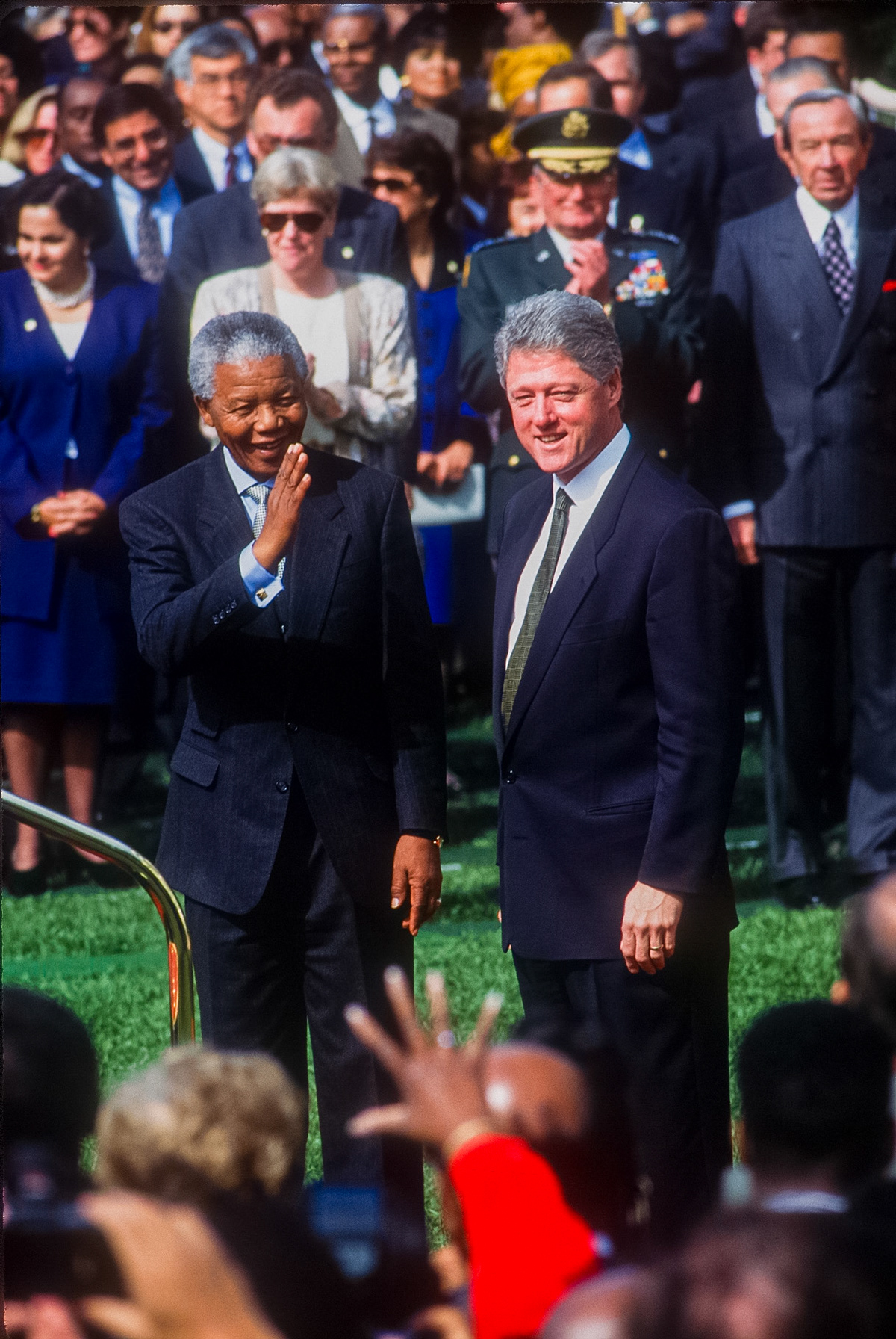 President Bill Clinton greets South African President Nelson Mandela on the South Lawn of the White House.