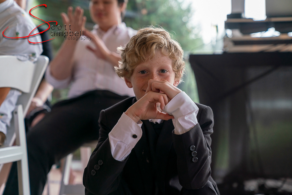 Picture of a young man all dressed up at a wedding. Taken by Scott Campbell Photography MT