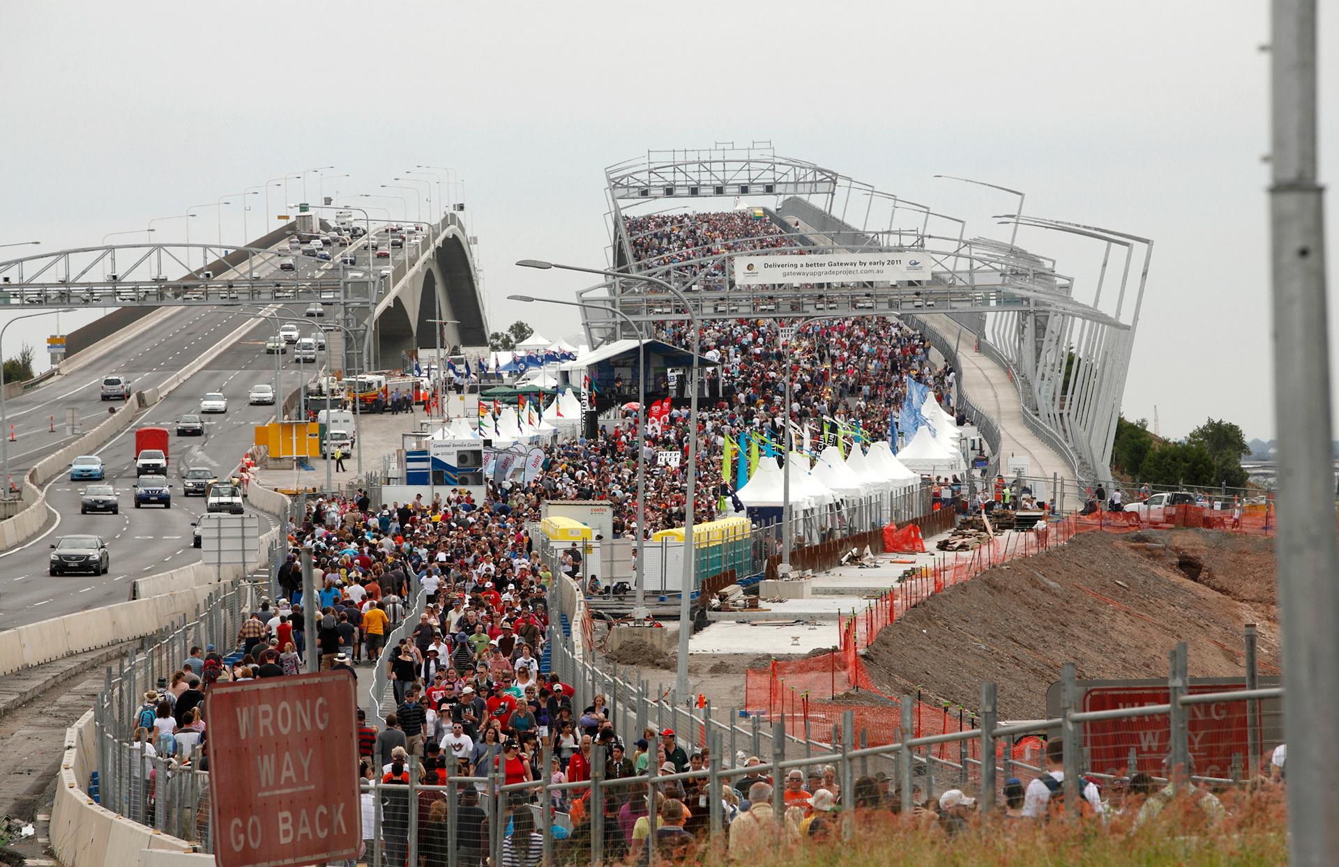 People walking across the new Gateway bridge during the Open Day celebrations