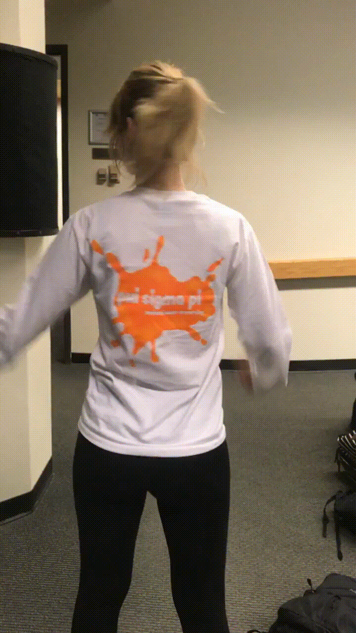 GIF of member wearing the shirts I designed for the chapter