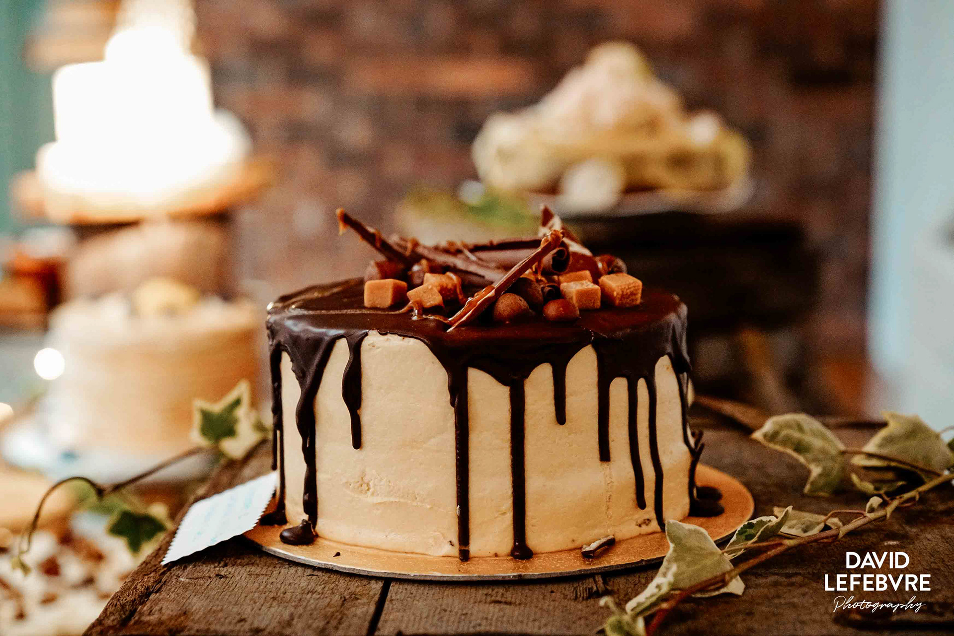 impressive large chocolate wedding cake at owen house wedding barn