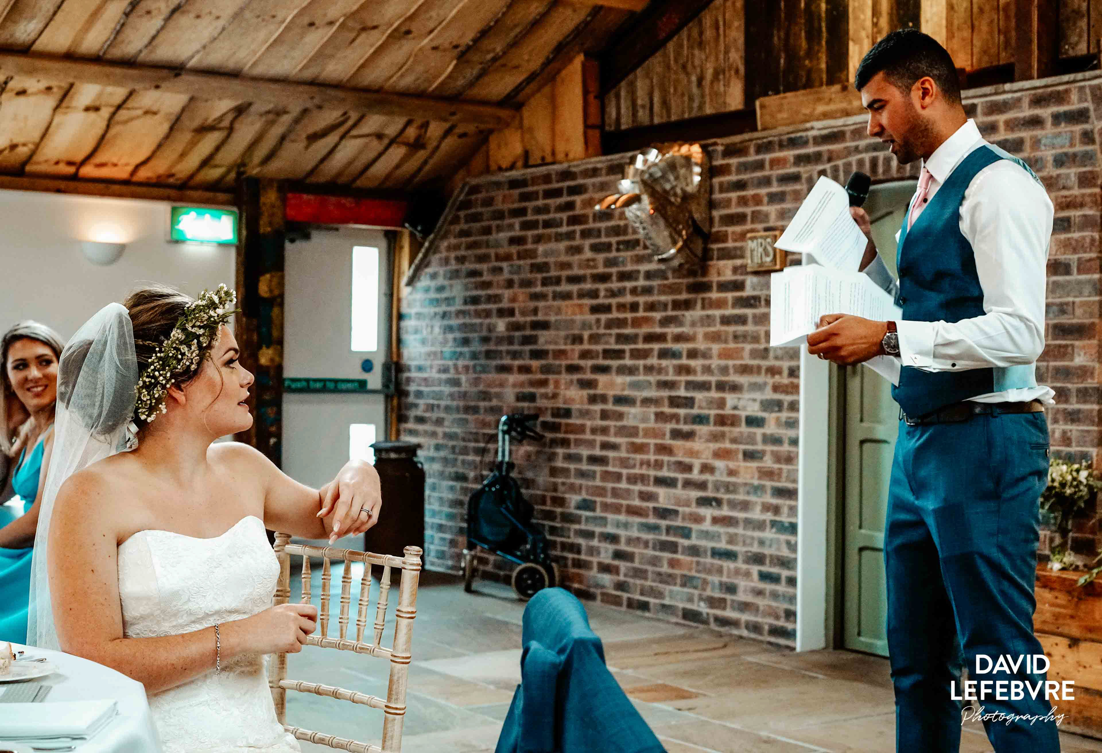 bride explaining grooms joke at owen barn house wedding