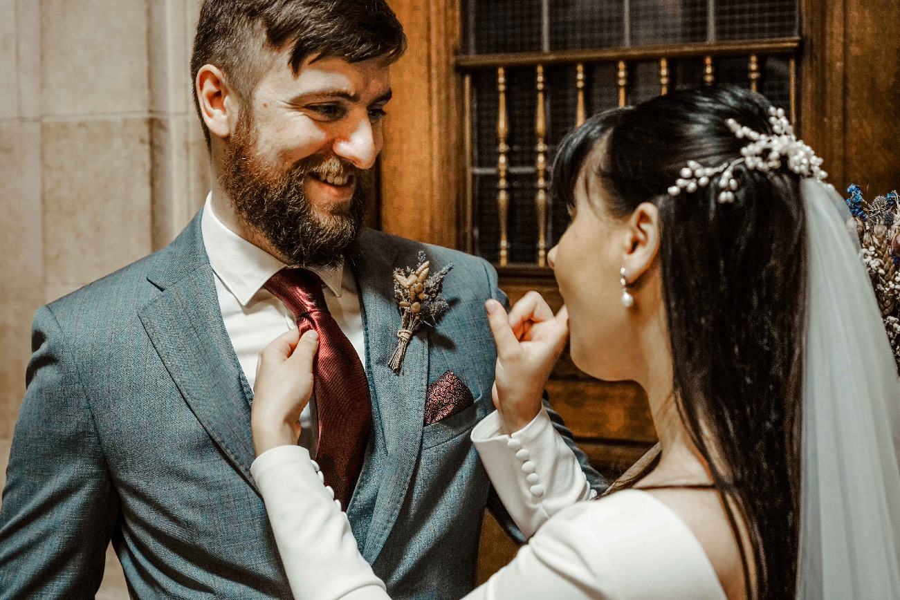 groom recieving telling off from bride during christmas covid wedding in oxford town hall with photographer david lefebvre