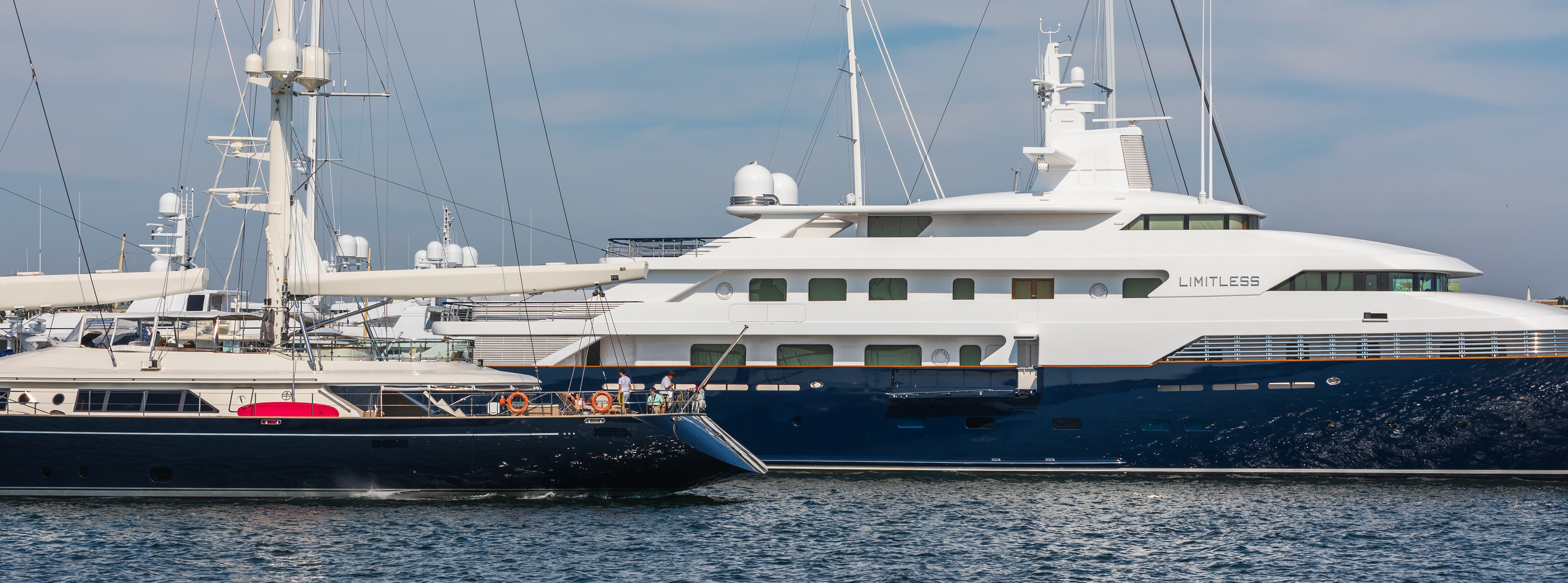 The "Zenji" passing by The Limitless superyacht docked in Newport Harbor