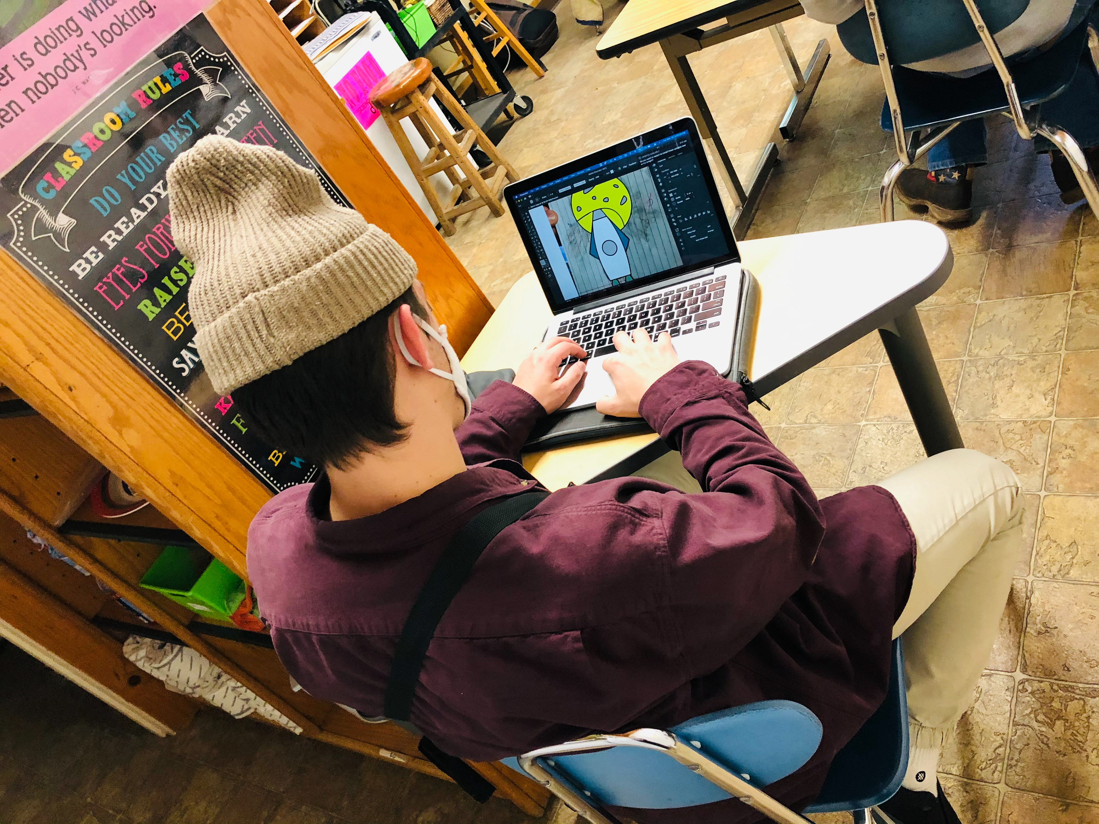 Christian making the groups logo sketches into reality