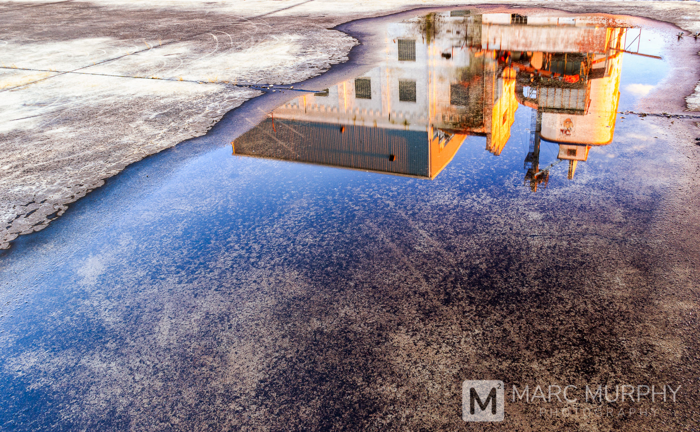 Downtown Johnson City Tennessee Old General Mill at Sunset with Puddle Reflection