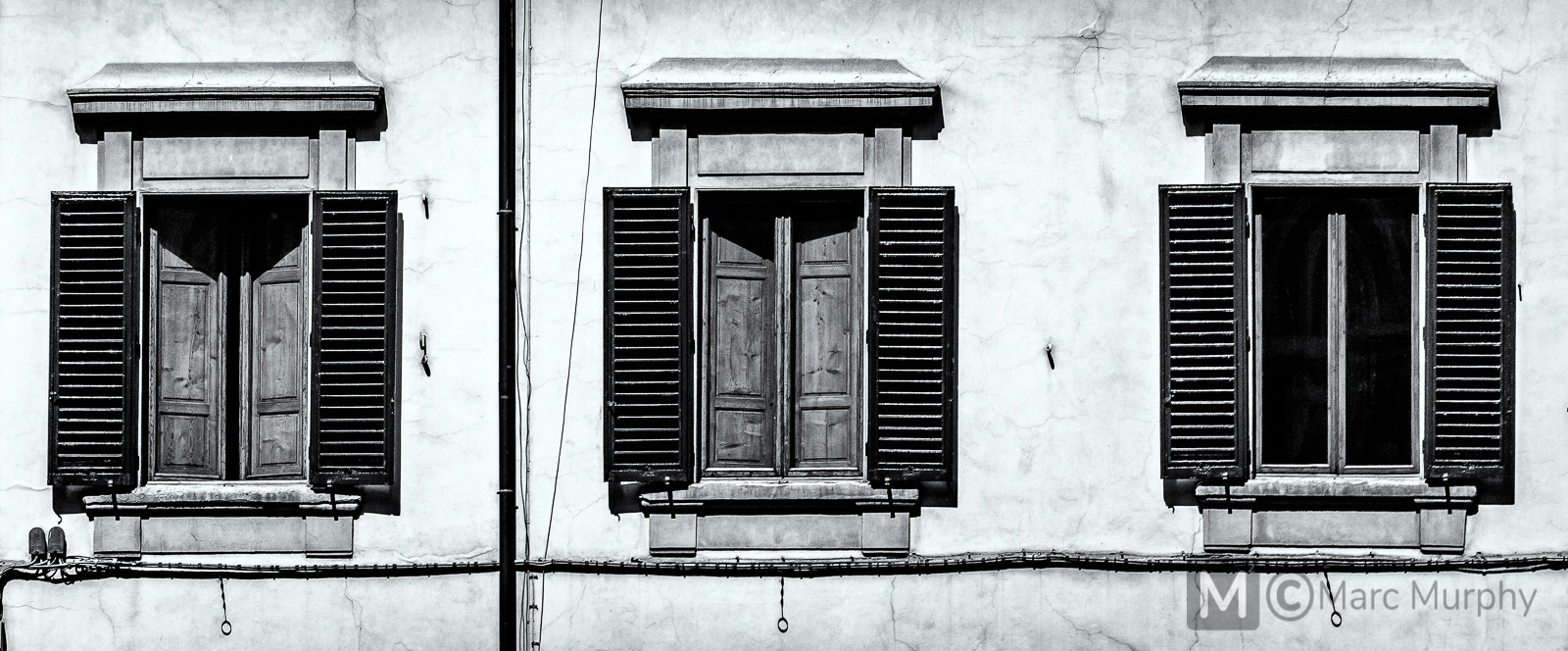 Panorama of three Black and White Antique Windows in Venice Italy with Wooden Shutters
