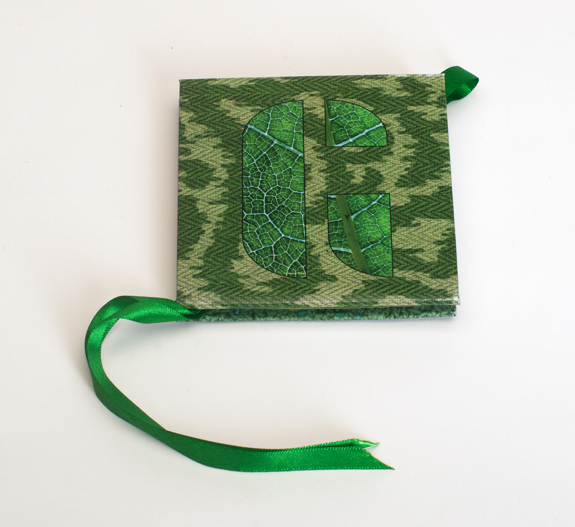 The back cover juxtaposes natural and synthetic textures 